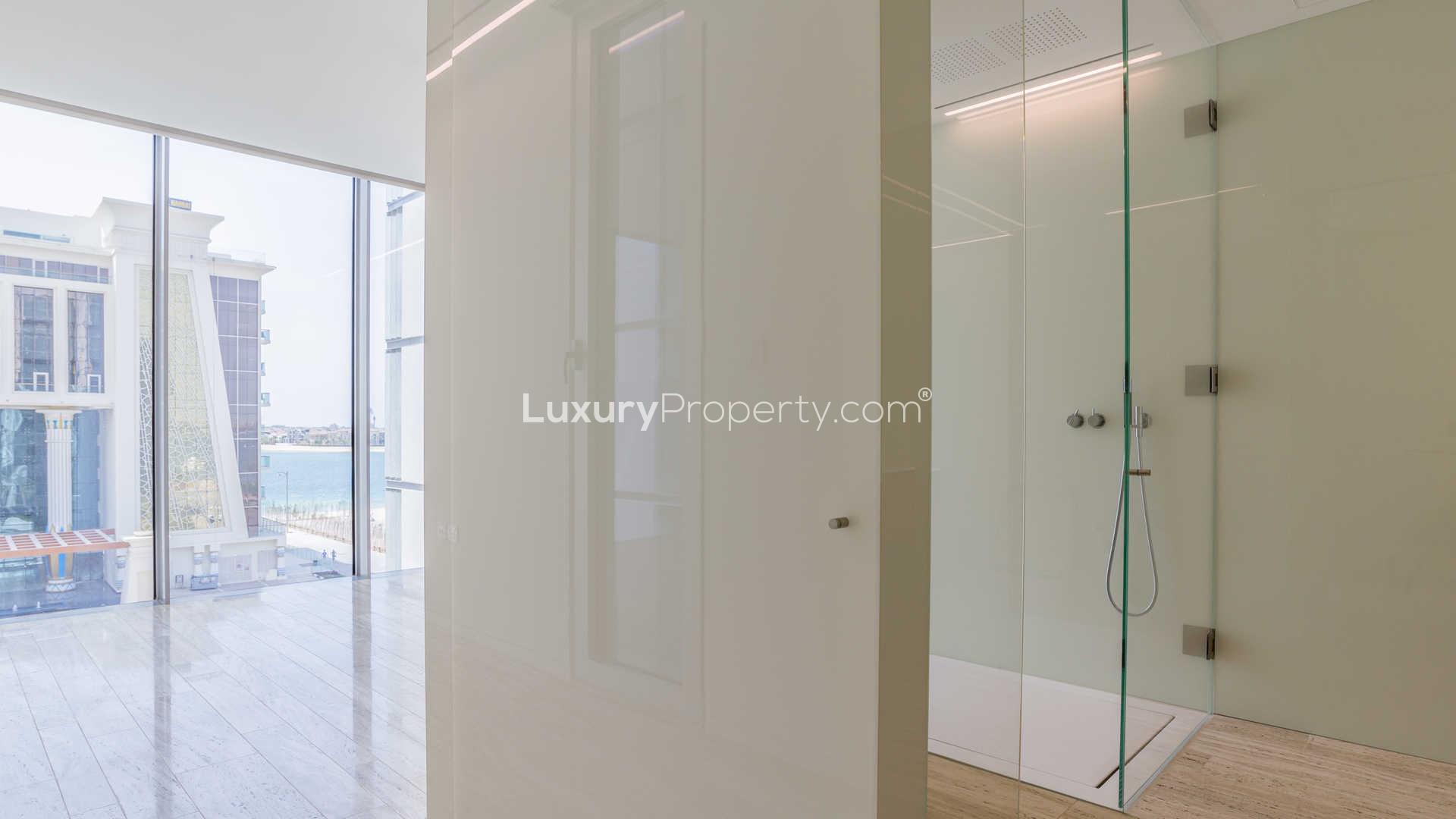 Modern shower and floor-to-ceiling windows in Muraba Residences apartment, Palm Jumeirah