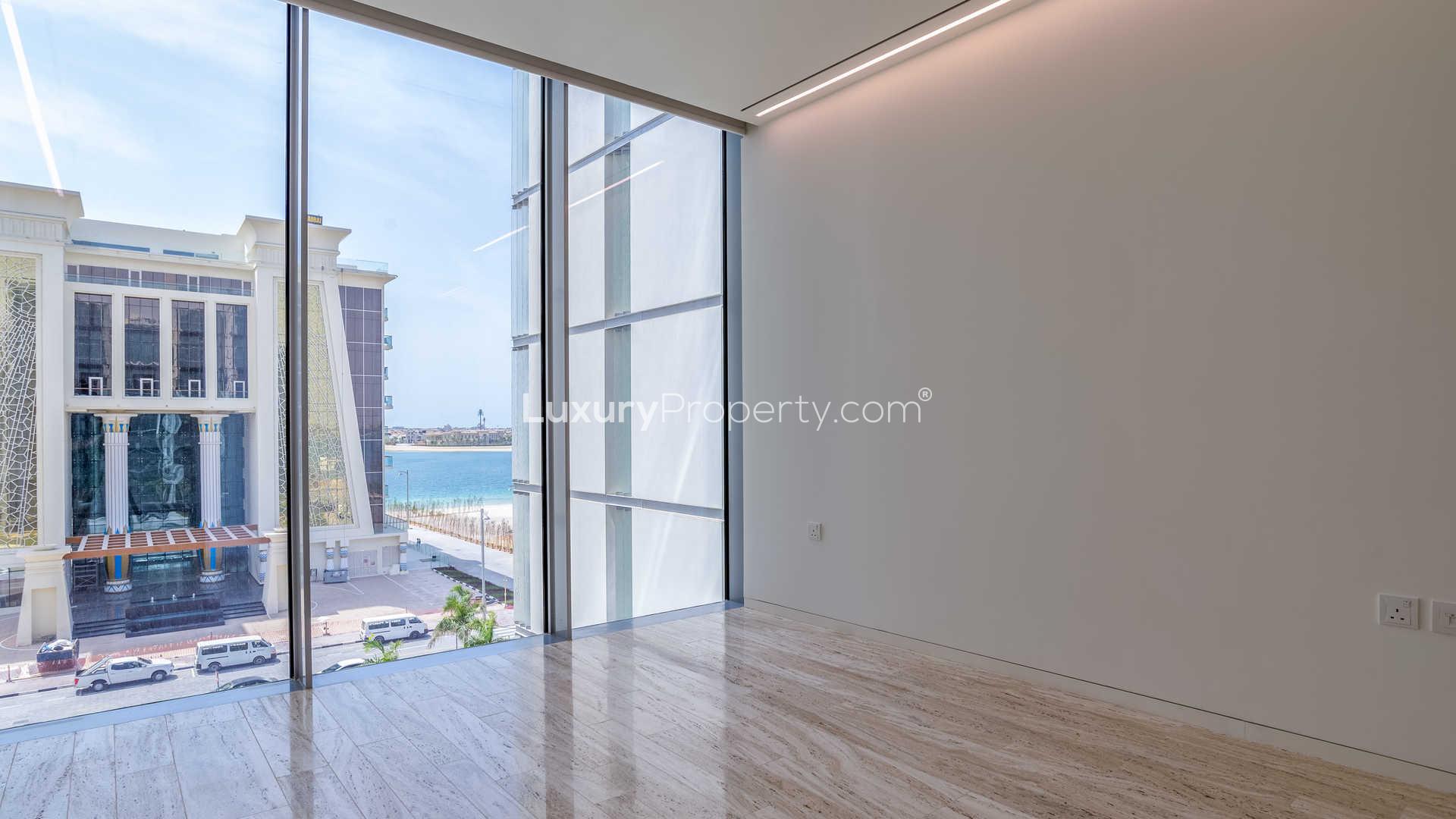 "Stunning ocean view from Muraba Residences apartment balcony, Palm Jumeirah, The Crescent.",Bright room with large windows and sea view in Muraba Residences, Palm Jumeirah