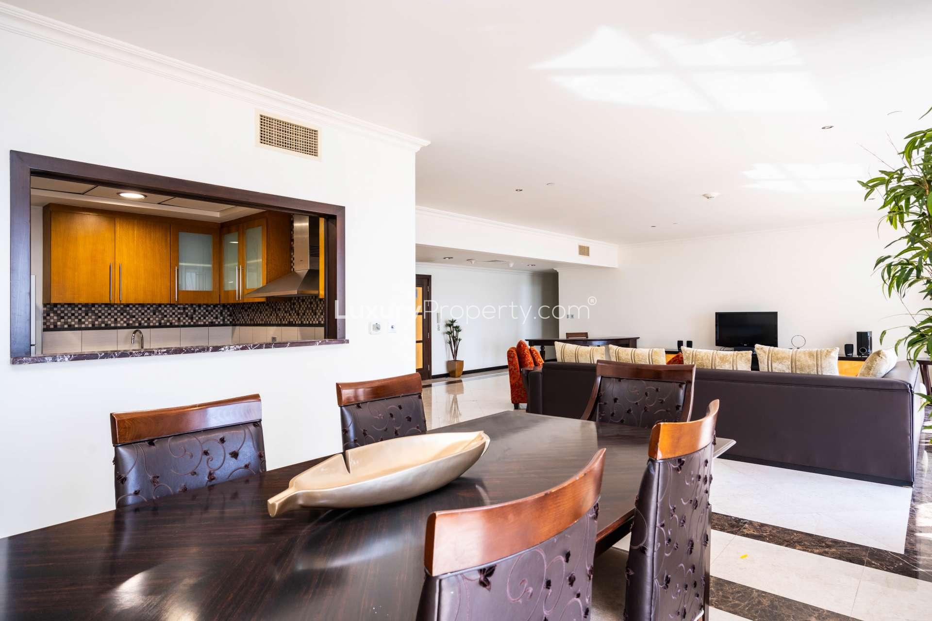 "Elegant dining area in 3-bedroom sea view apartment, Murjan 4, JBR, available for rent.",Dining and living area in Murjan 4 sea view apartment, JBR, with modern furnishings