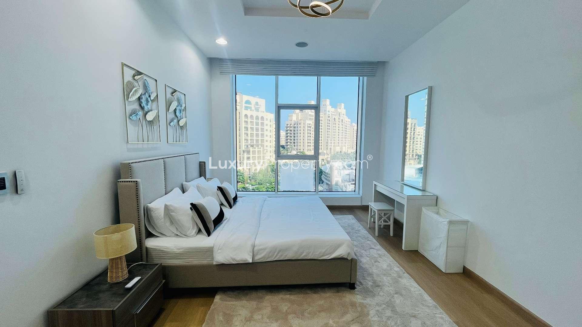 Refurbished bedroom in Palm Jumeirah apartment with sea view, modern decor, and large windows