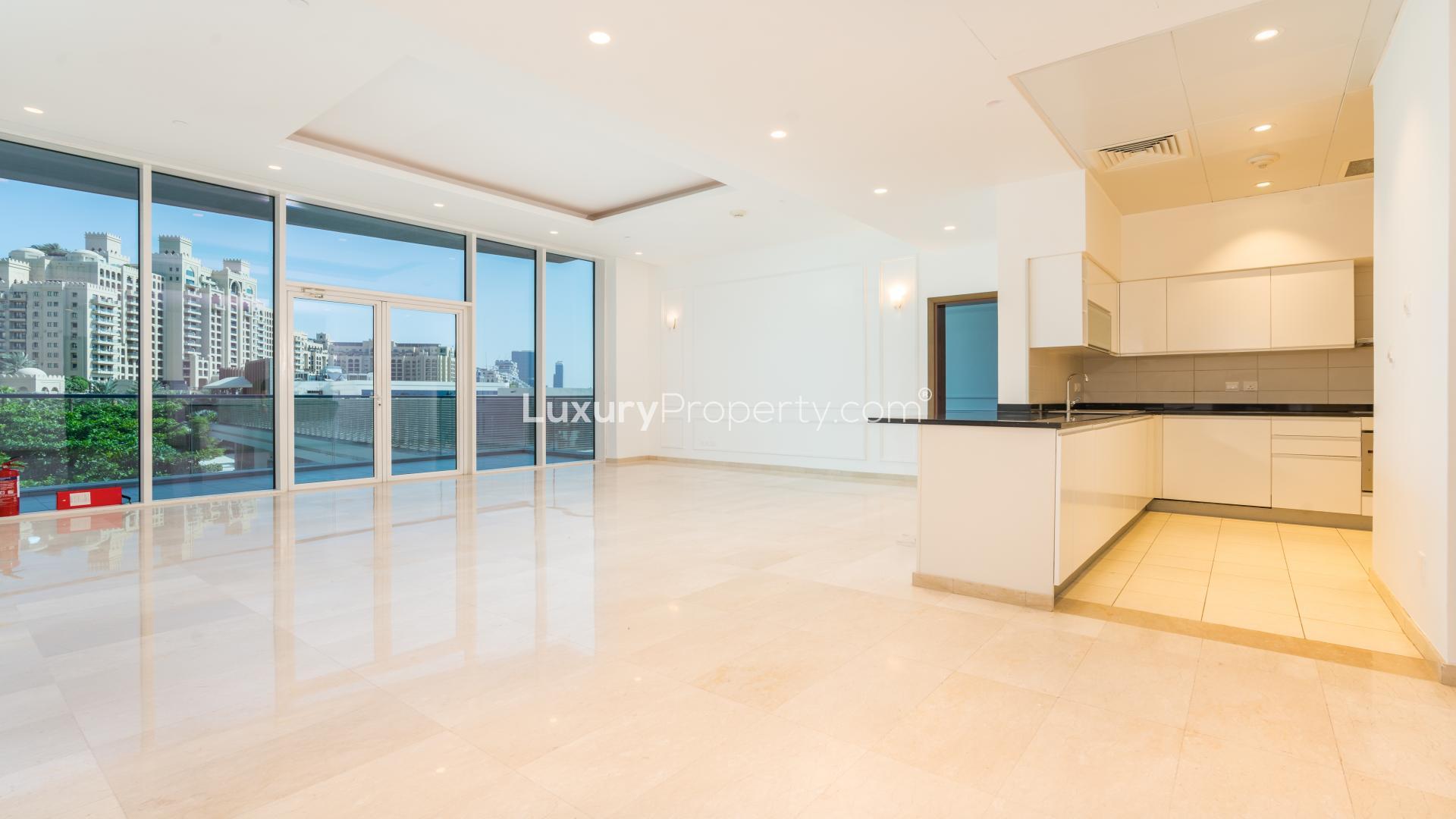 Empty room with wooden floors and large window in Oceana apartment, Palm Jumeirah
