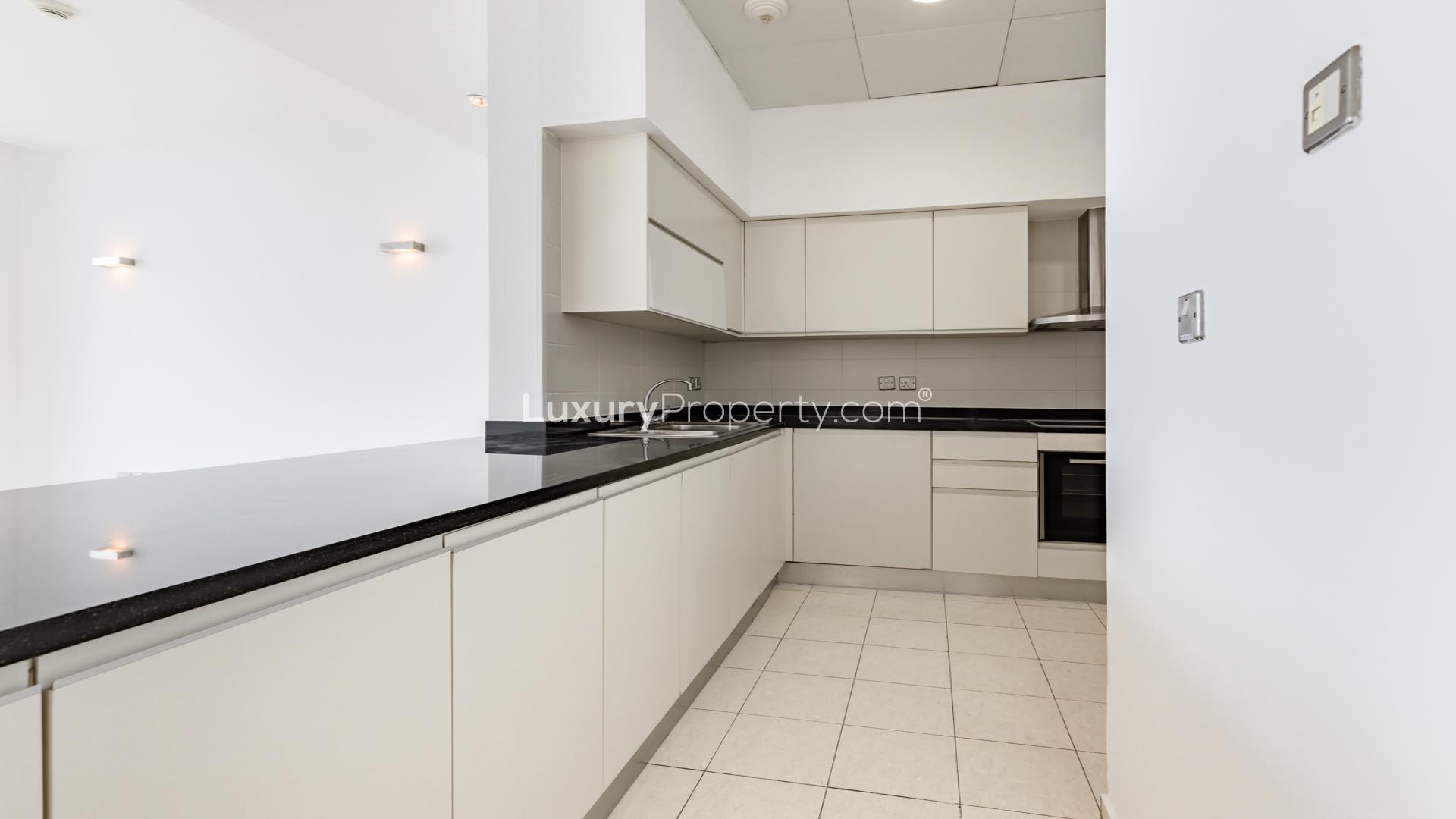 Spacious living area in Oceana Caribbean apartment, Palm Jumeirah, with modern kitchen