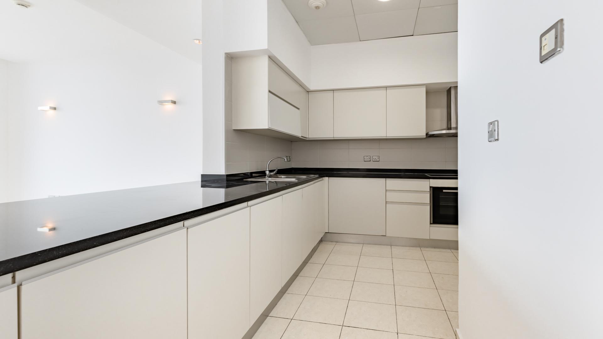 Spacious living area in Oceana Caribbean apartment, Palm Jumeirah, with modern kitchen