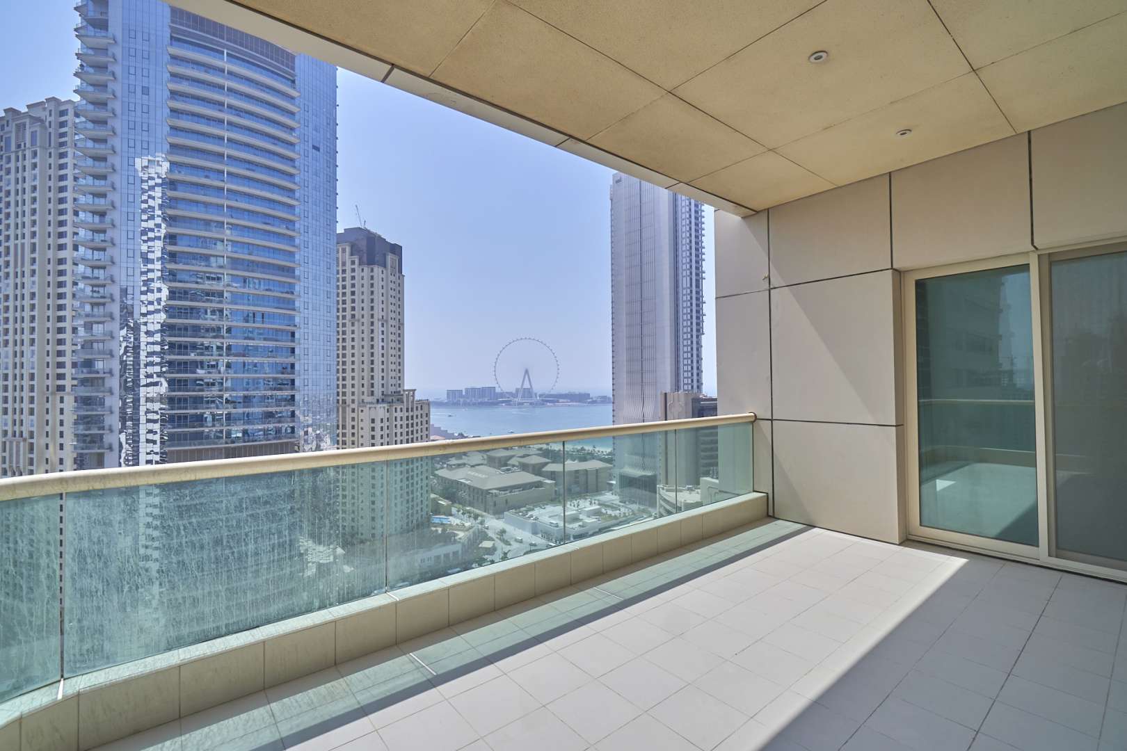 Luxurious Dubai Marina apartment with balcony view, modern interior, large windows, natural light