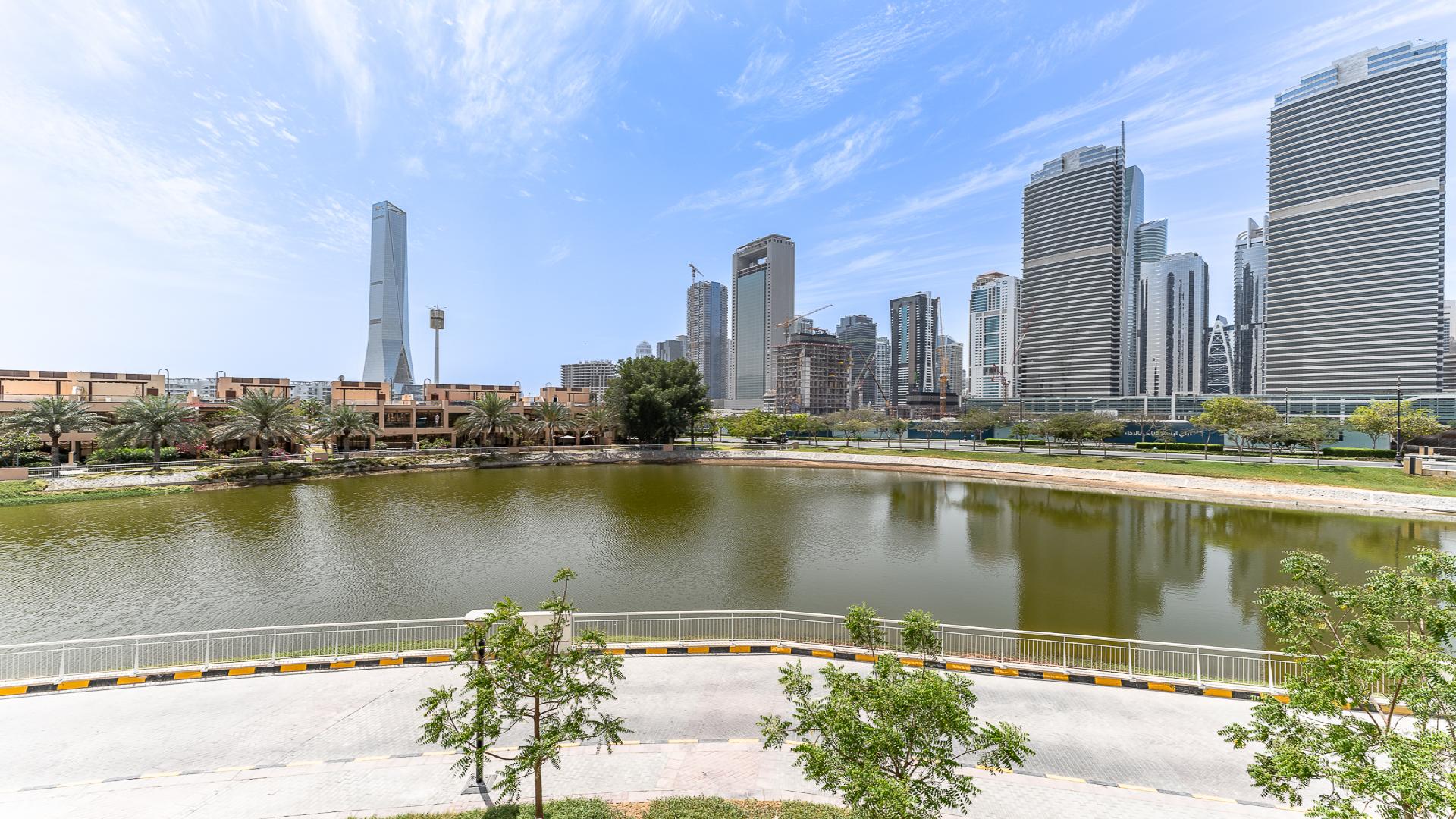 Upgraded Jumeirah Heights duplex terrace with lake views and modern outdoor seating