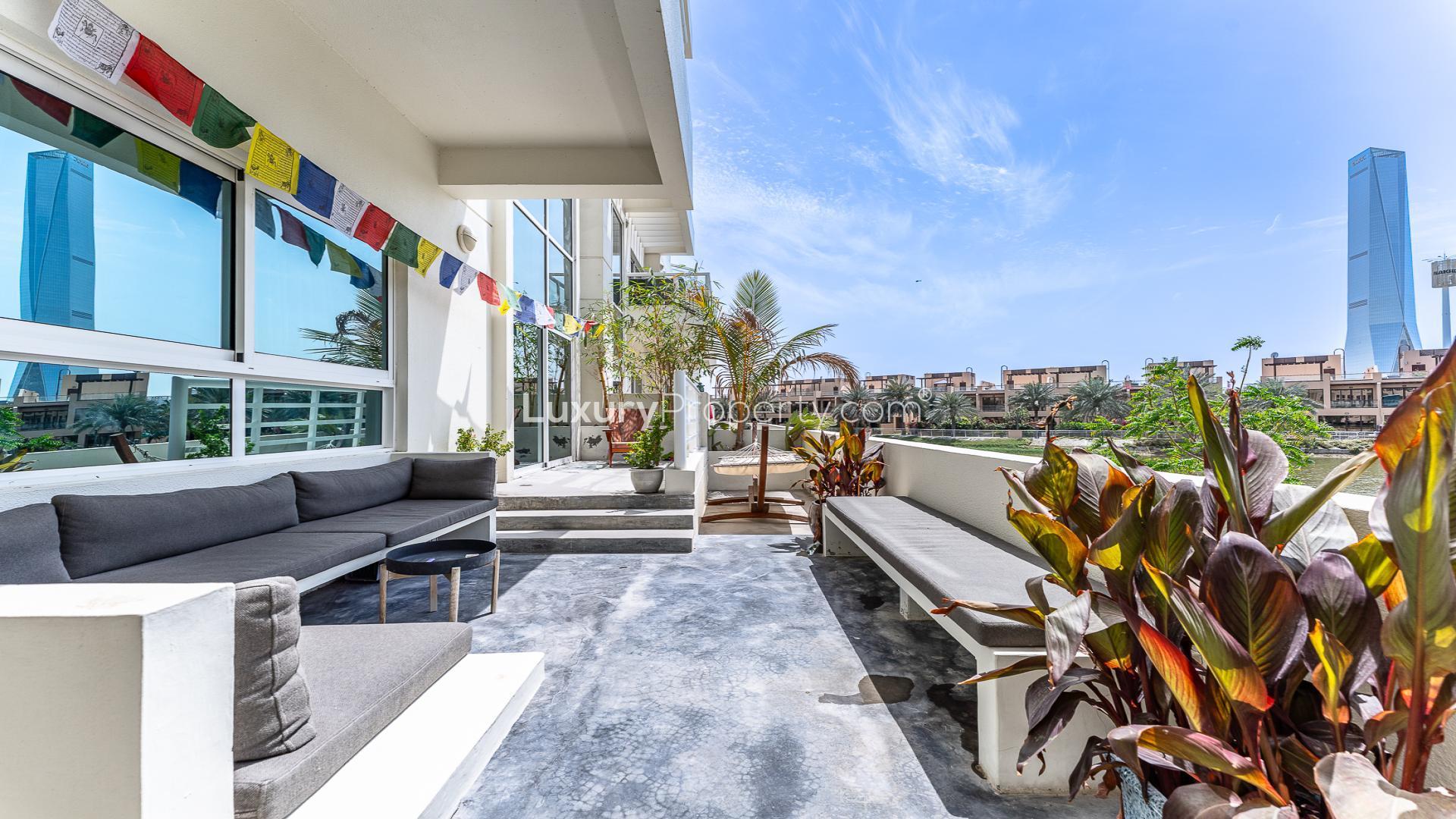 Modern living area in upgraded Jumeirah Heights duplex apartment with stylish decor and open layout