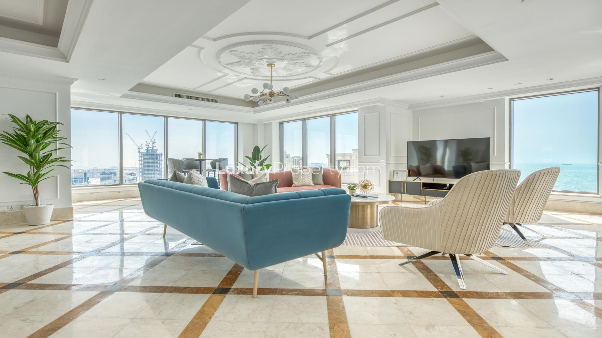 Luxurious living area with pool table and sea views in Orra Marina apartment, Dubai Marina