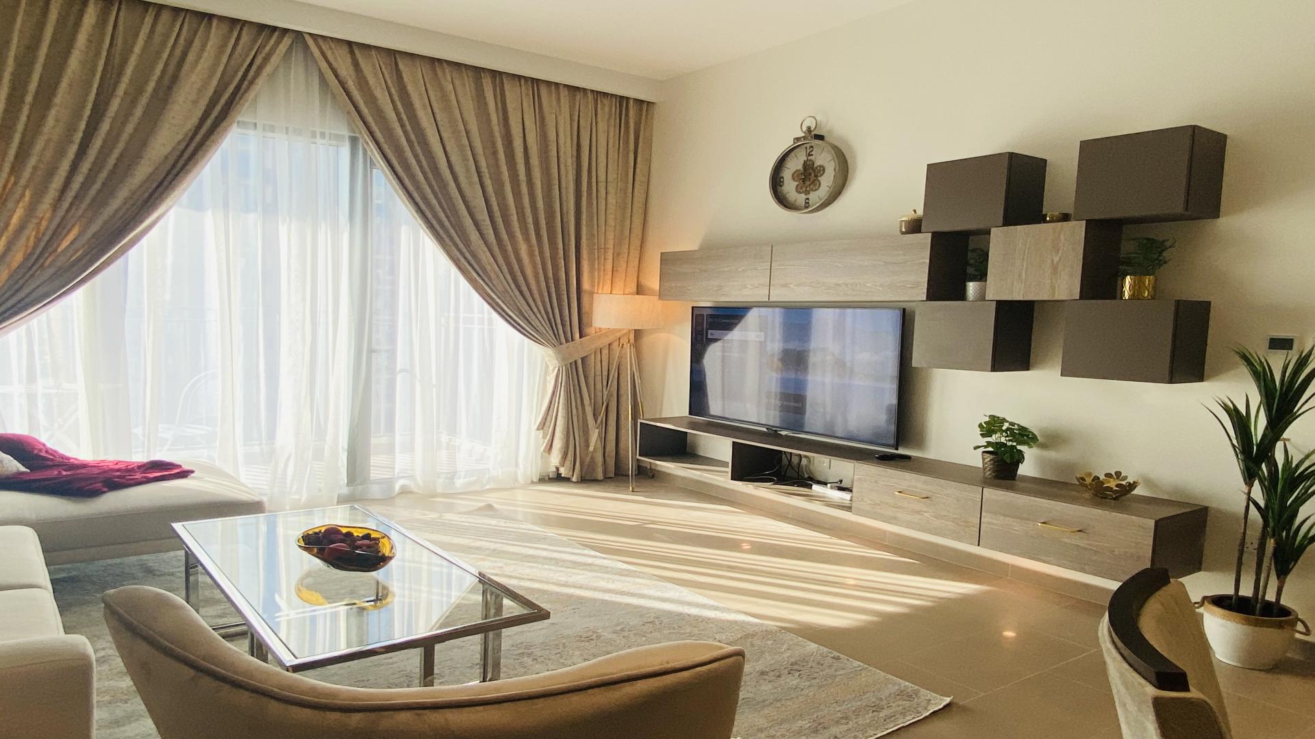 Balcony view from furnished apartment in Park Heights, Dubai Hills Estate, overlooking cityscape