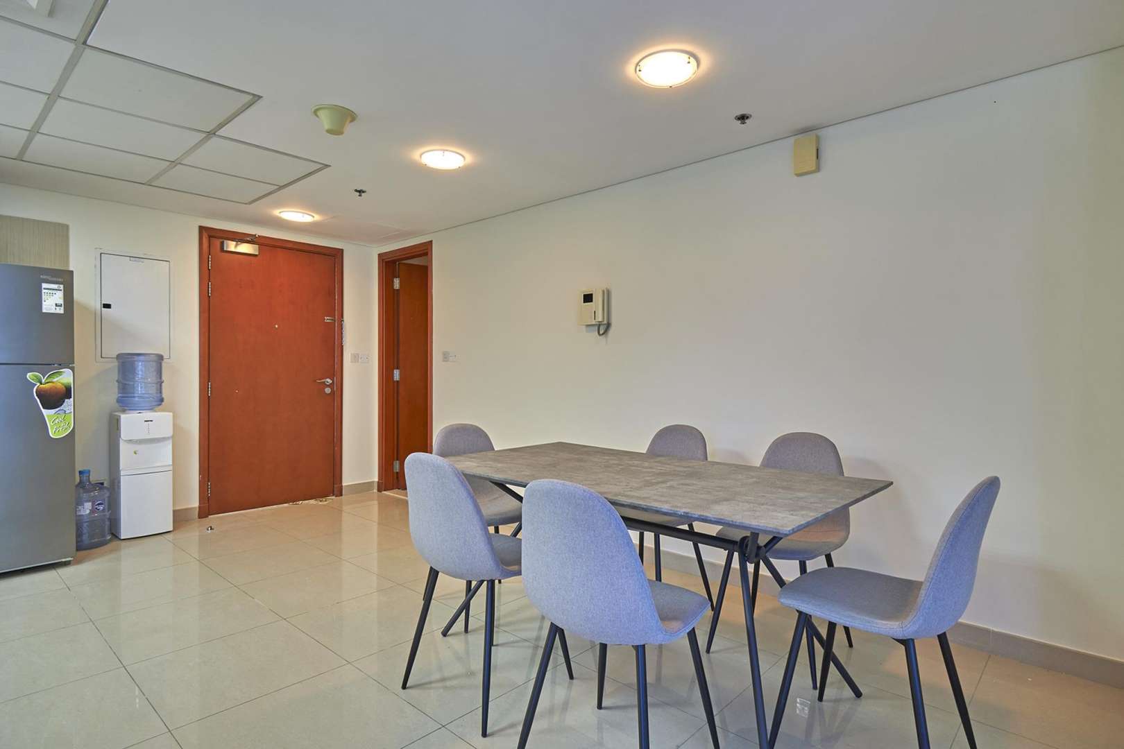 Bright living room in DIFC Park Towers apartment with city views through large windows
