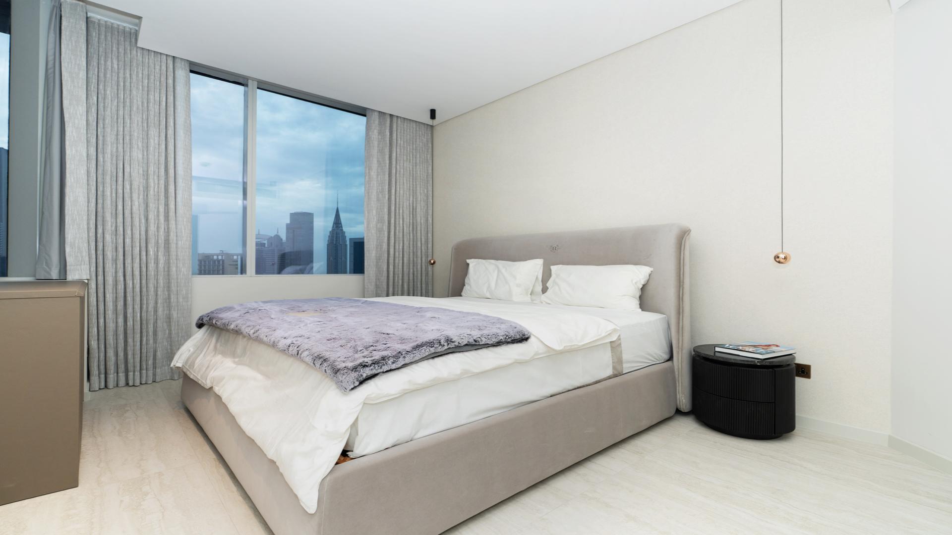 Dining area in spacious 2-bedroom Sky Gardens apartment, DIFC, with modern decor and lighting