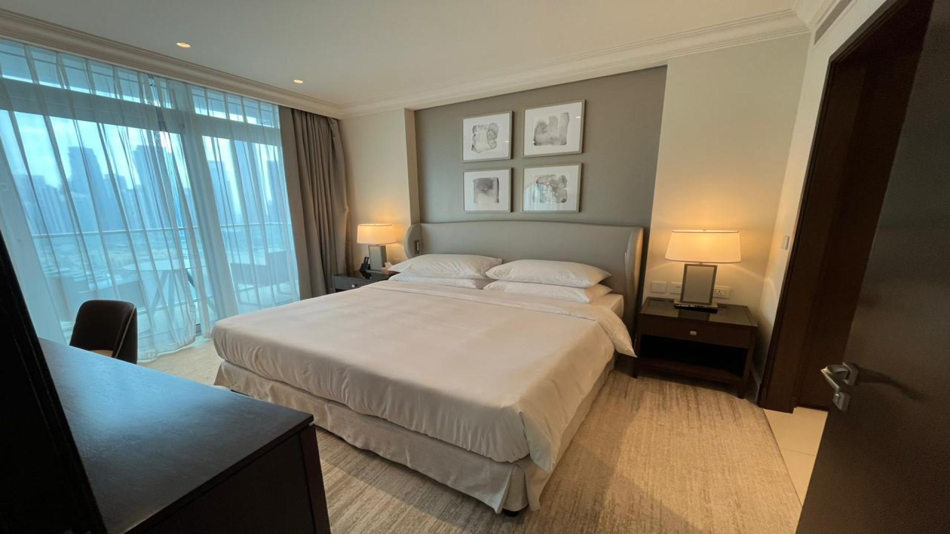 Modern living room in Vida Residences apartment, Downtown Dubai, with elegant decor and large window