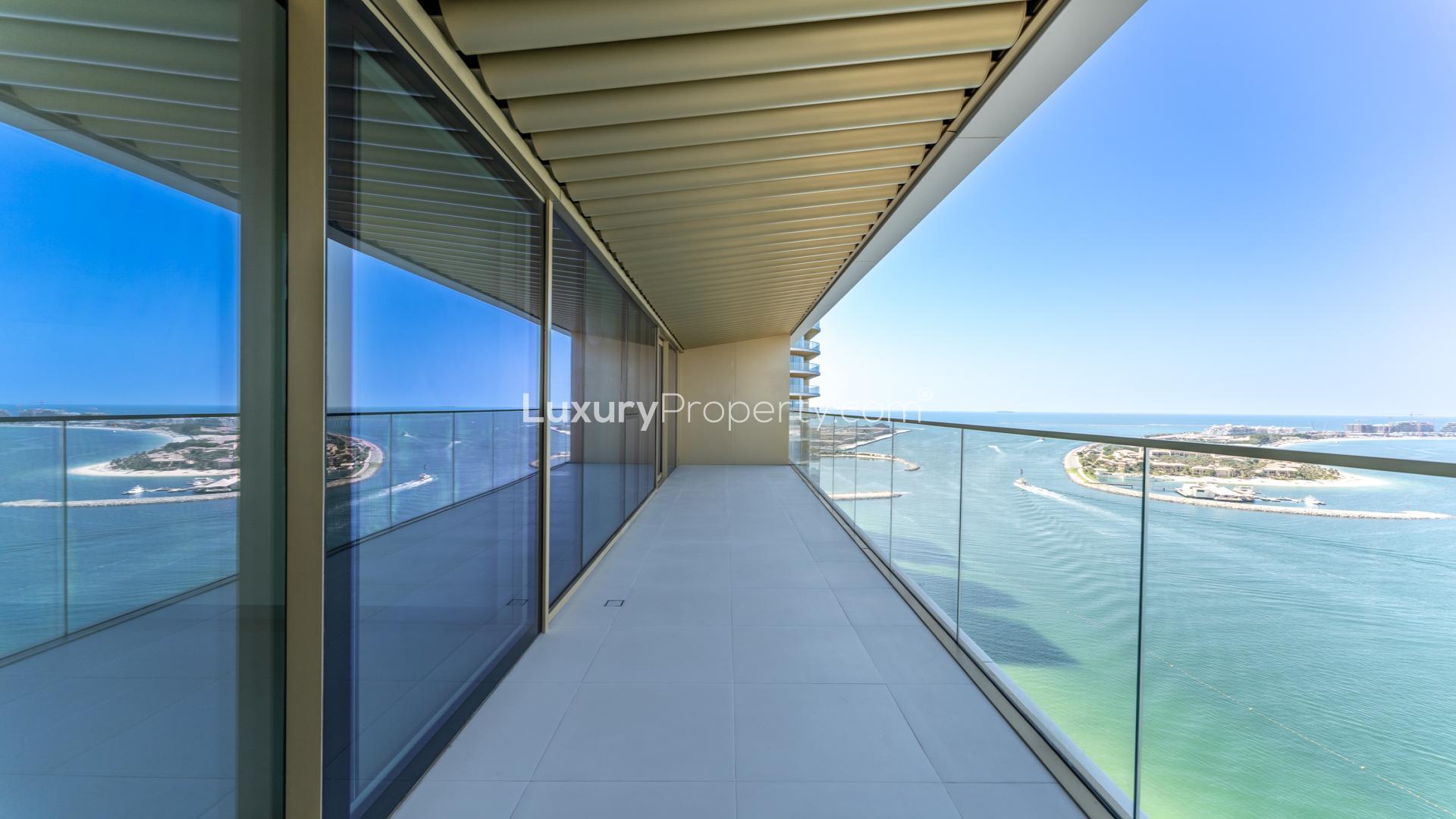 Modern kitchen and living area with sea view in Elie Saab apartment, Emaar Beachfront