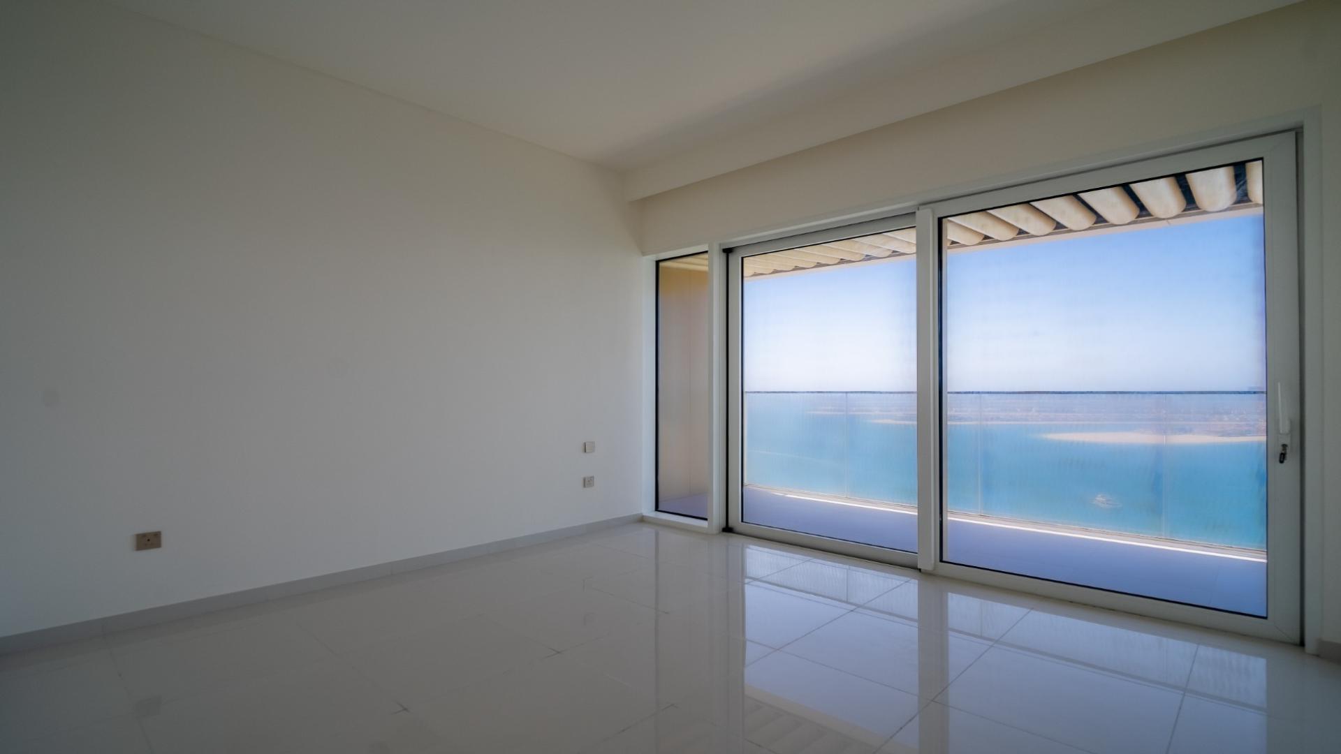 Stylish open-plan kitchen and living area in Elie Saab apartment, Dubai Harbour