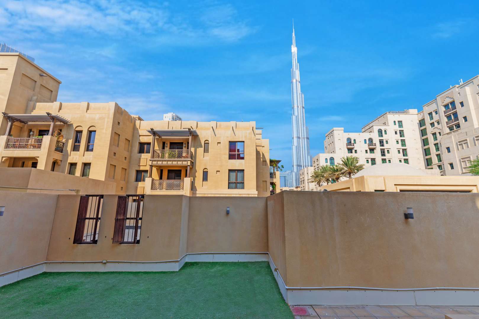 Outdoor terrace with Burj Khalifa view in 2-bedroom Old Town apartment for rent