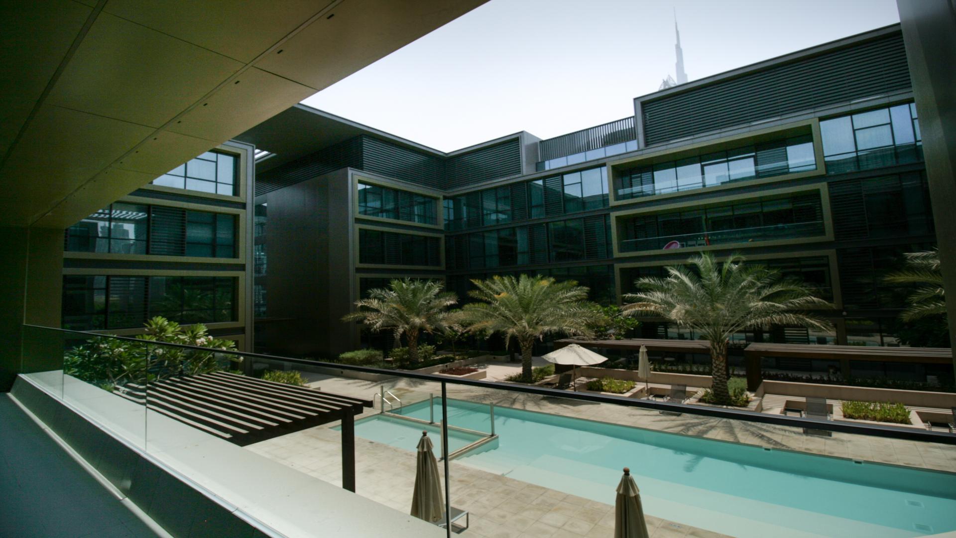 Empty living room with large windows in City Walk, Building 23A apartment for rent