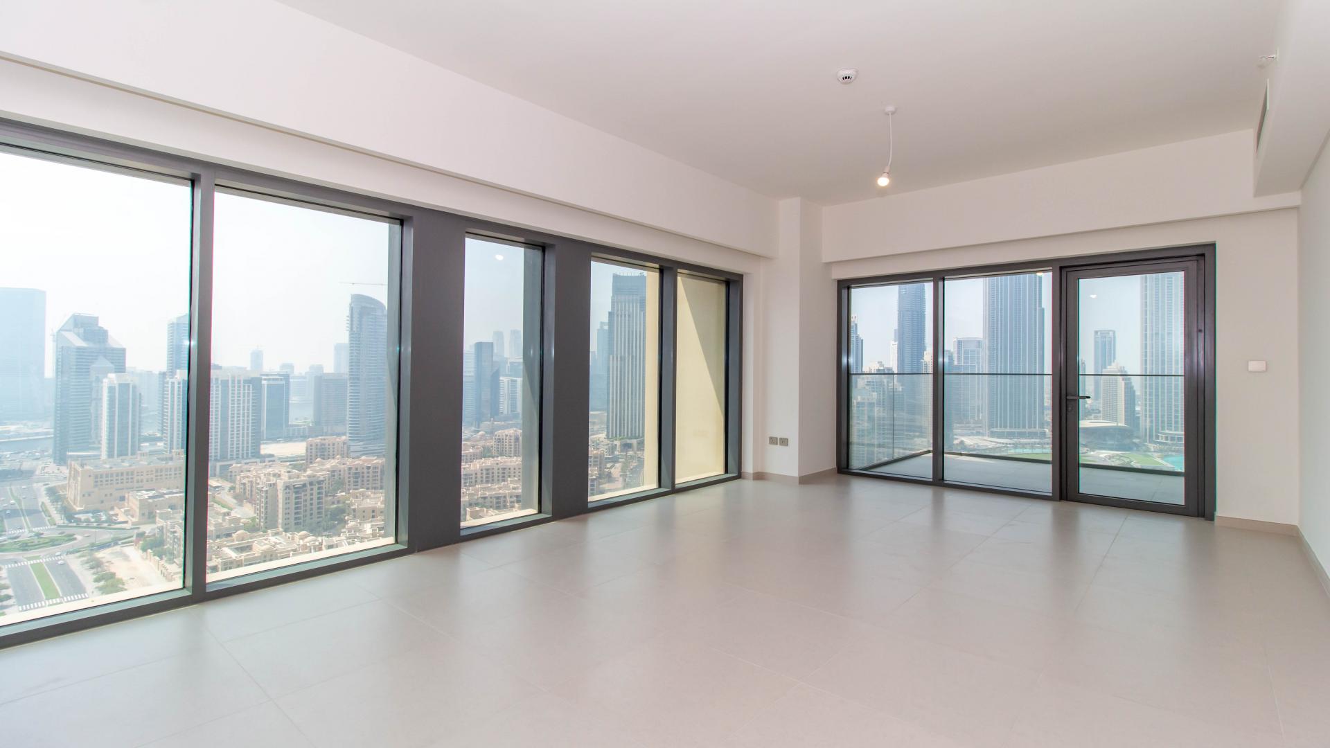 Spacious living room with city views in Burj Royale apartment, Downtown Dubai