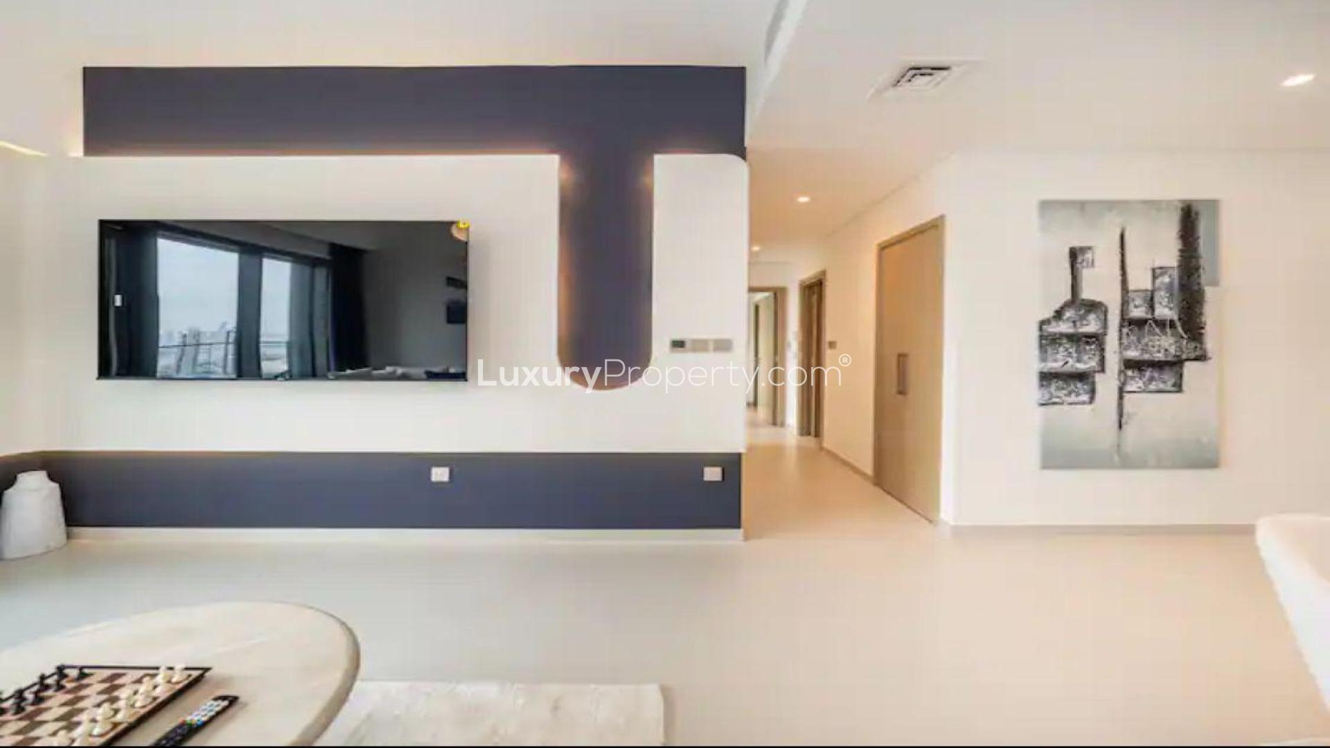 Modern bedroom interior in Burj Royale apartment, Downtown Dubai, featuring stylish decor and TV