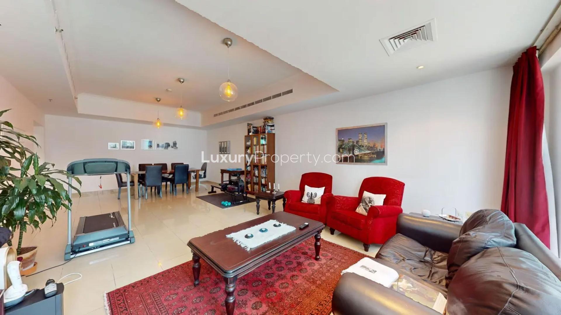 Furnished living room with city views in Dubai Marina apartment, Emirates Crown