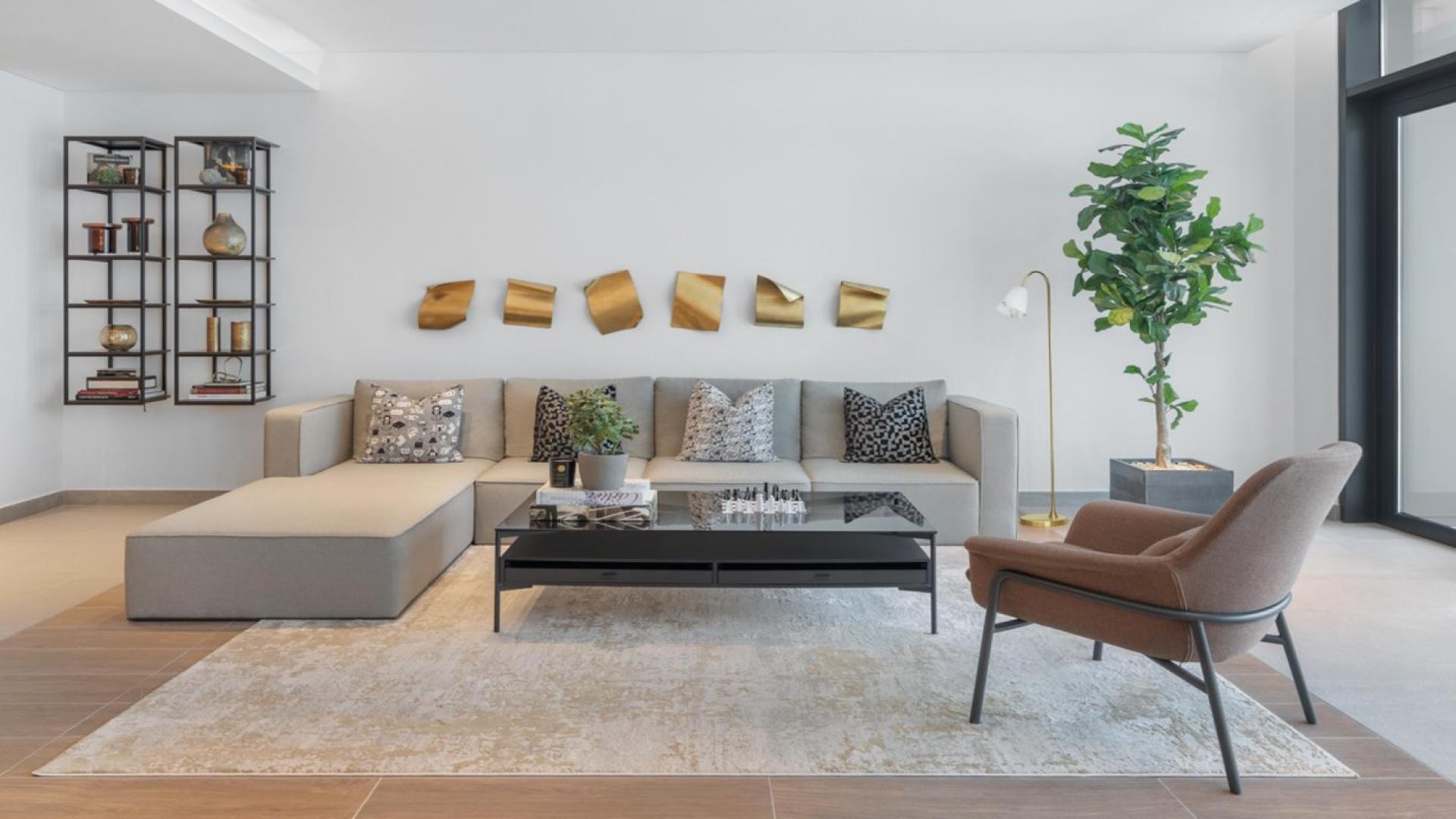 Entrance of DT1 Apartment Building in Downtown Dubai with modern design and greenery