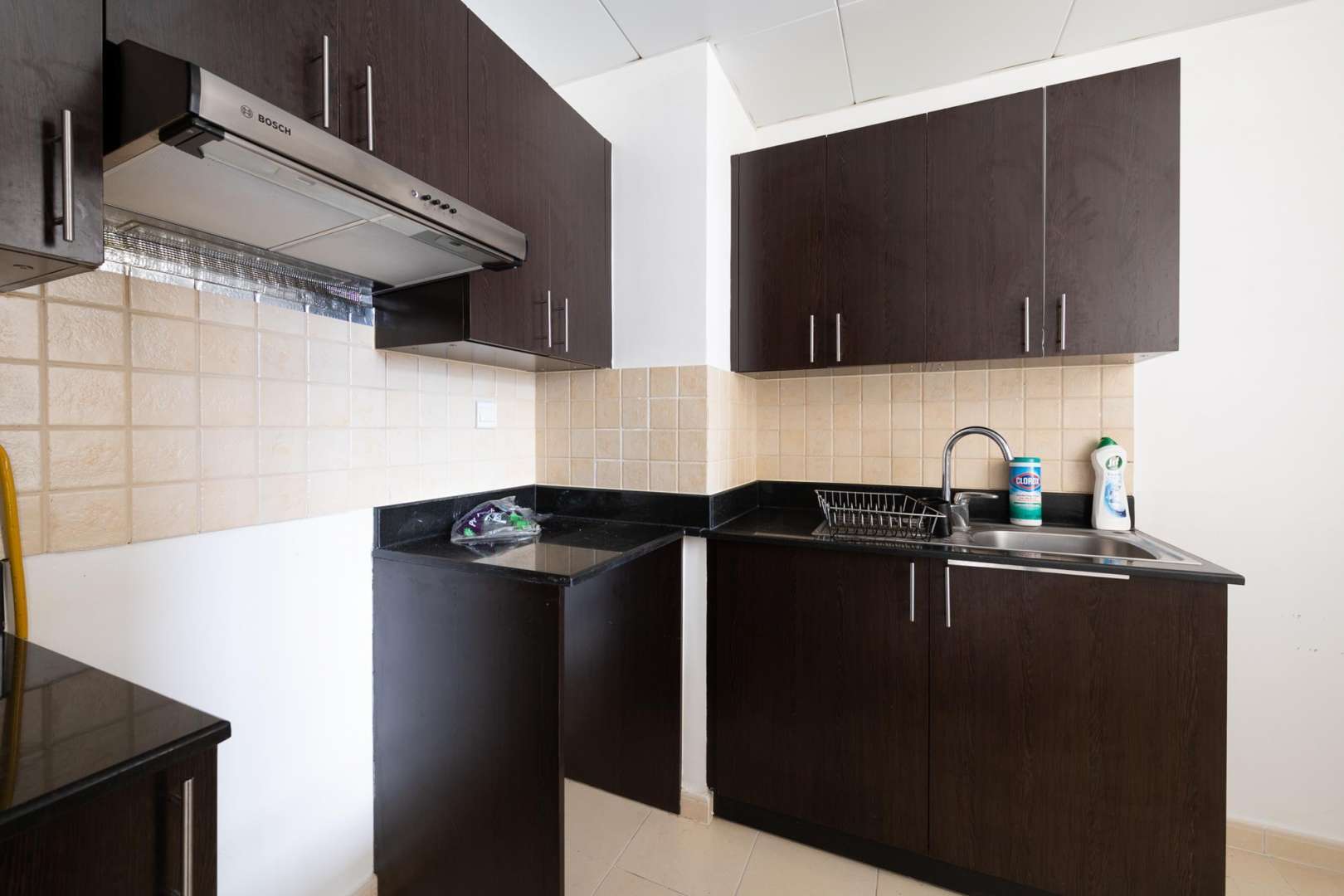 Spacious living area in JVC apartment for rent, featuring modern open layout design