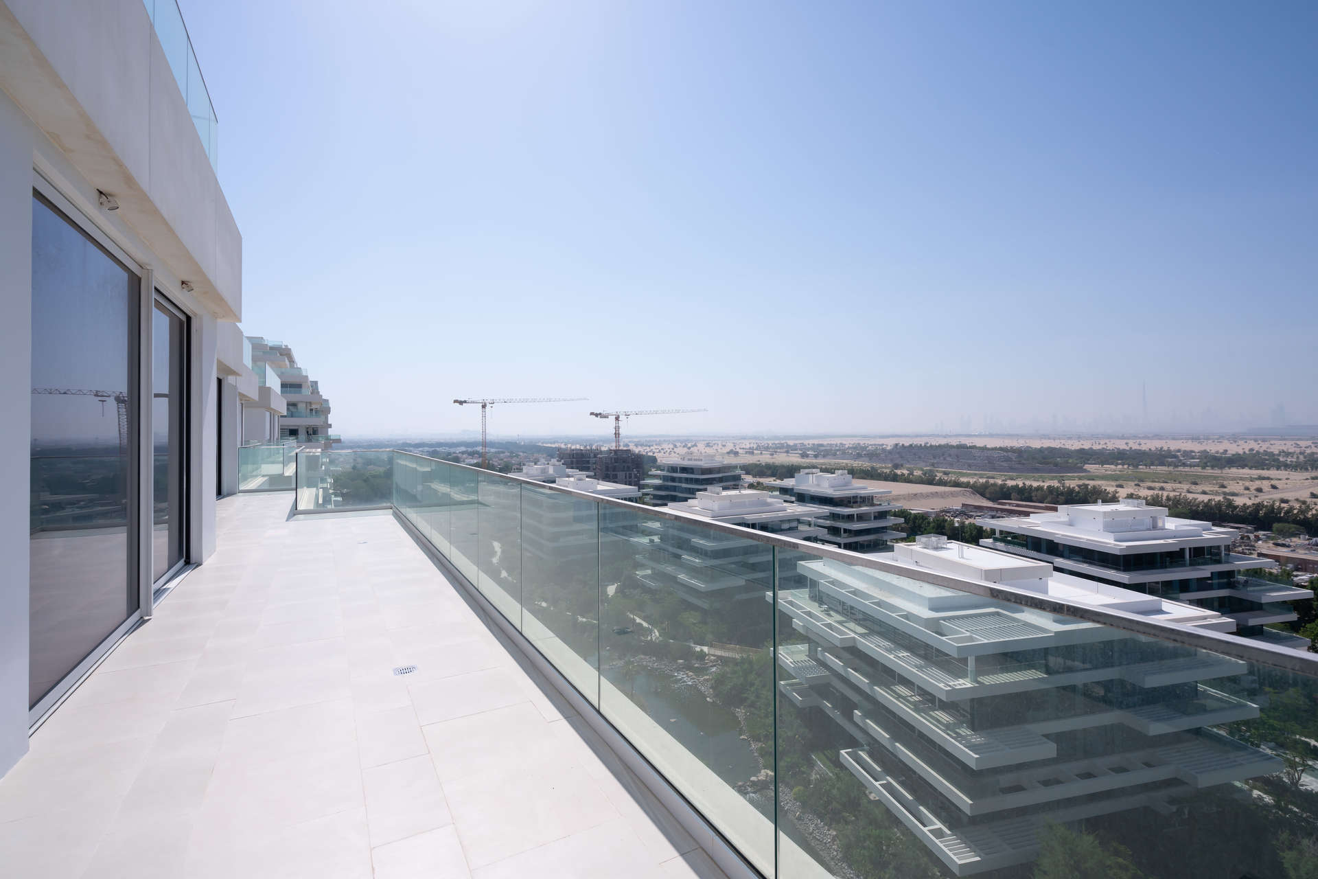 Luxurious Al Barari apartment with large windows and stunning views in Seventh Heaven