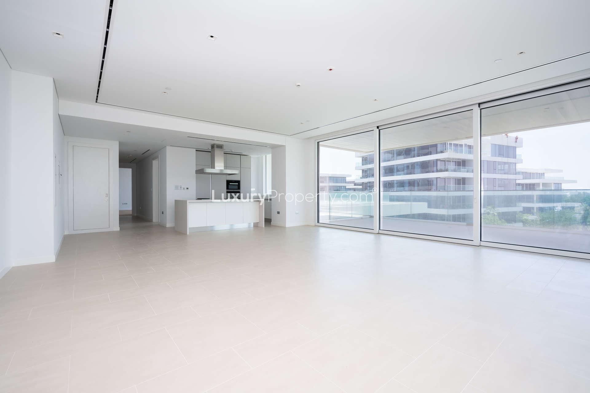 Empty living room with wooden floors in Seventh Heaven, Al Barari apartment for rent