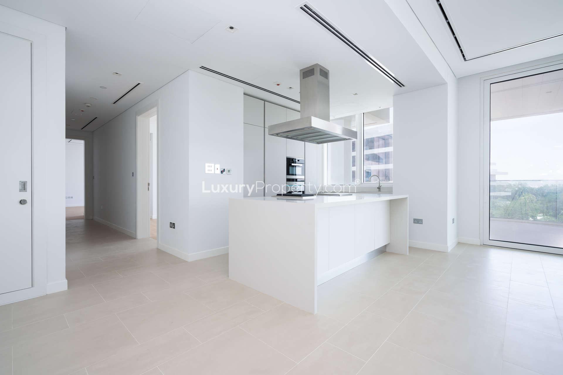 Spacious living room with large windows in Seventh Heaven apartment, Al Barari