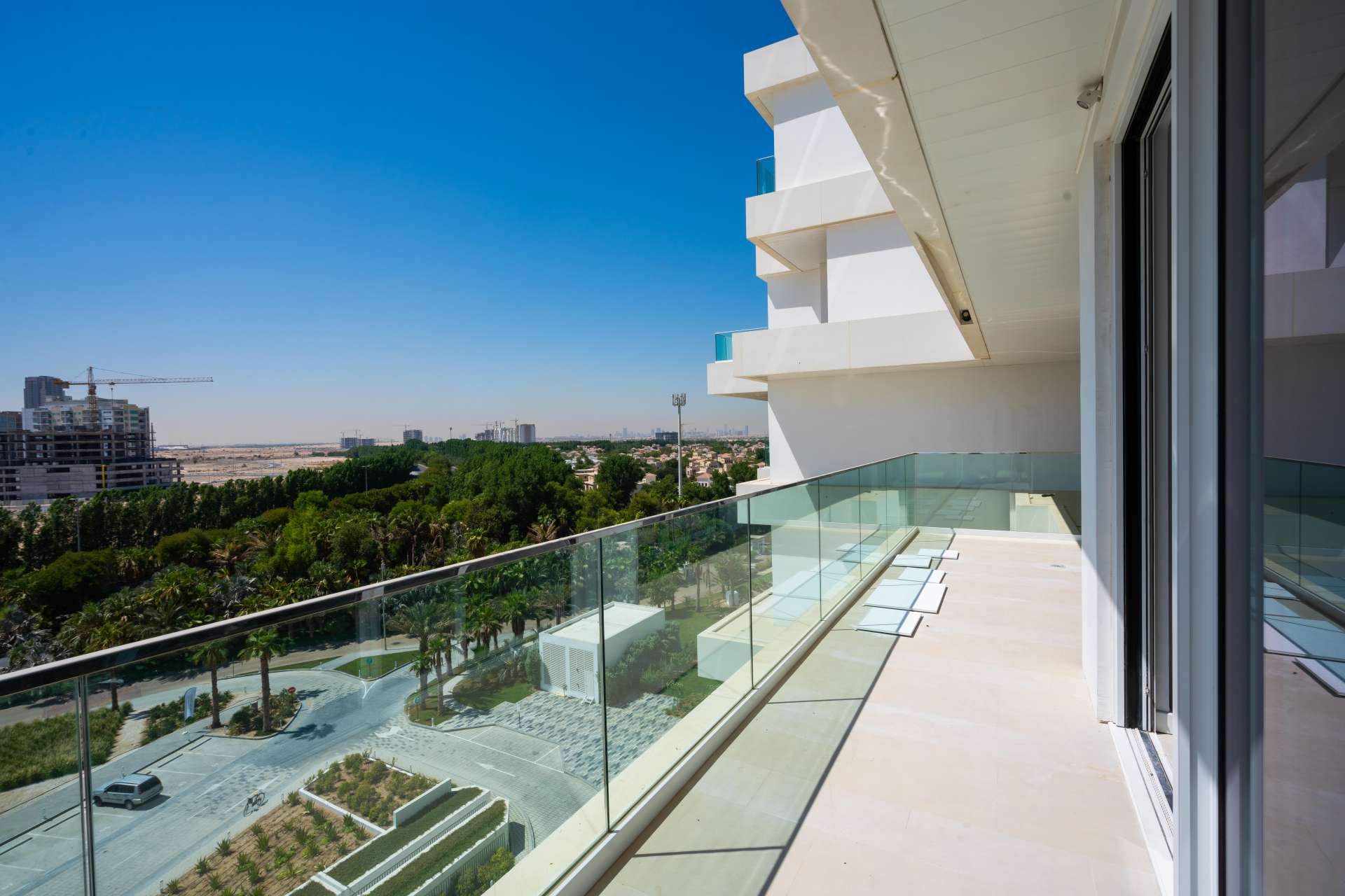 Modern open-plan living area with large windows in Seventh Heaven, Al Barari apartment