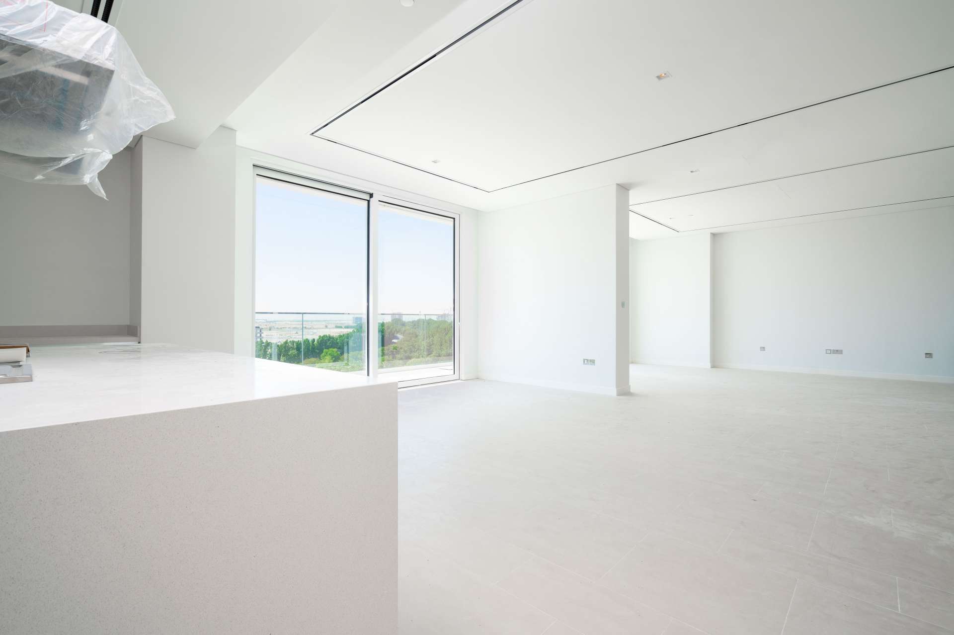 Modern open-plan kitchen and living area in Seventh Heaven apartment, Al Barari