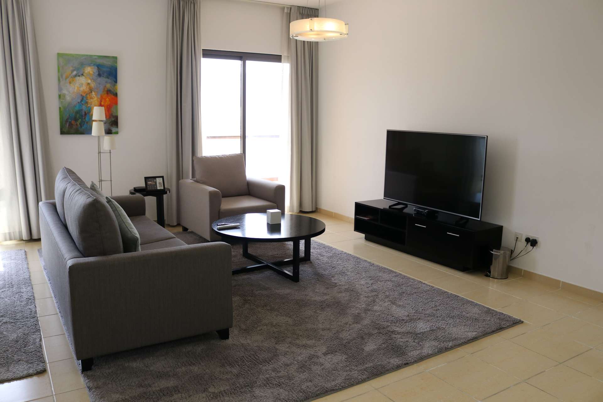 Furnished living area in 2-bedroom apartment, Shams 1, JBR, with modern decor and open kitchen