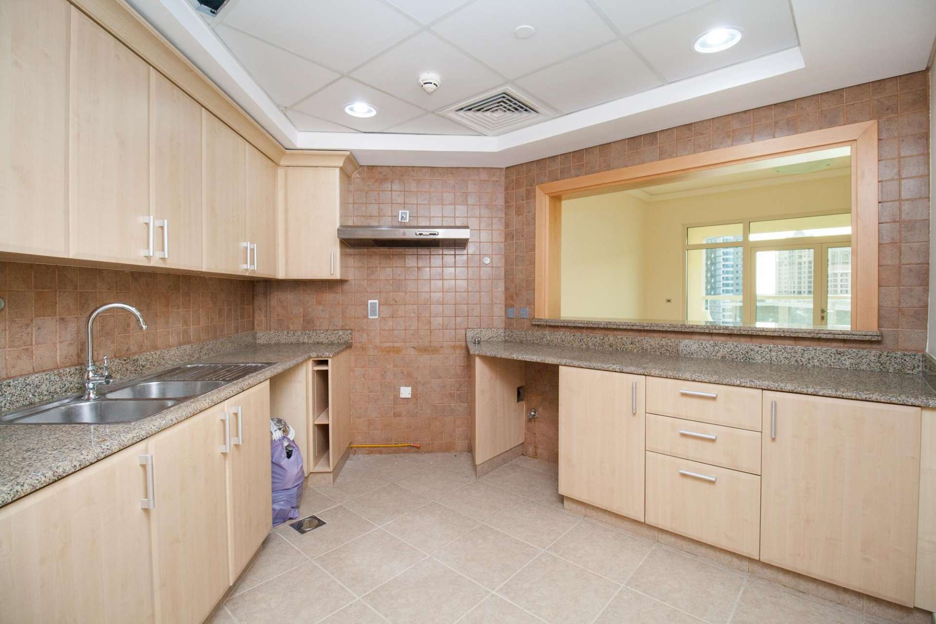 Empty bedroom with large window in Shoreline Residences apartment, Palm Jumeirah