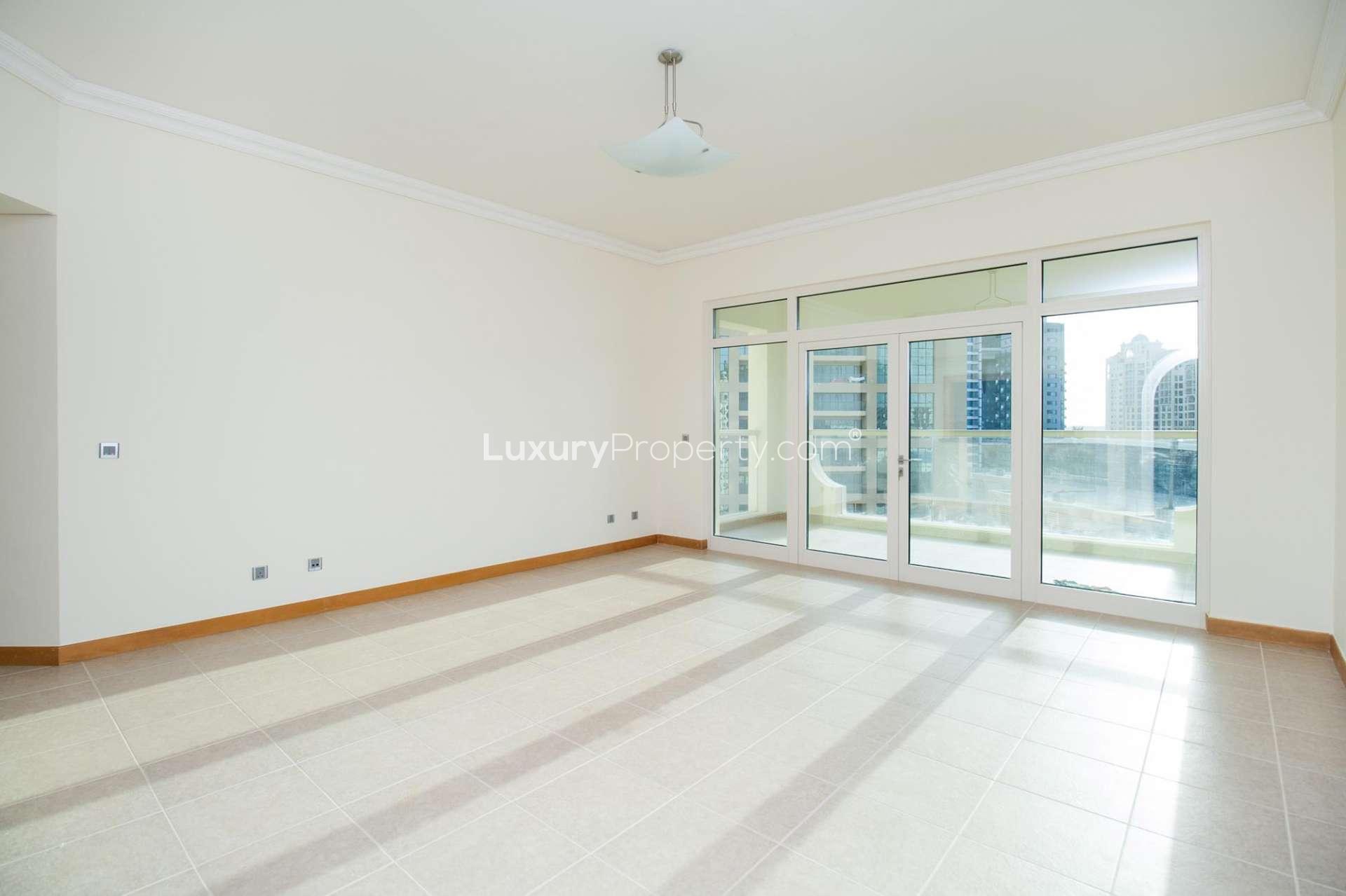 Spacious kitchen in 2-bedroom apartment, Shoreline Residences, Palm Jumeirah, with modern wood cabinets