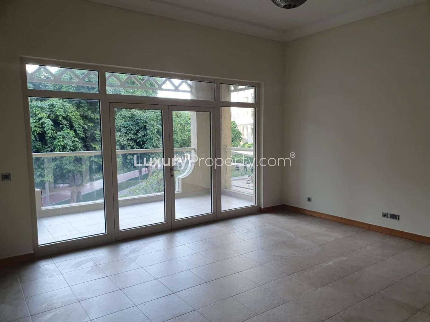 Spacious living room with large windows in Palm Jumeirah apartment for rent