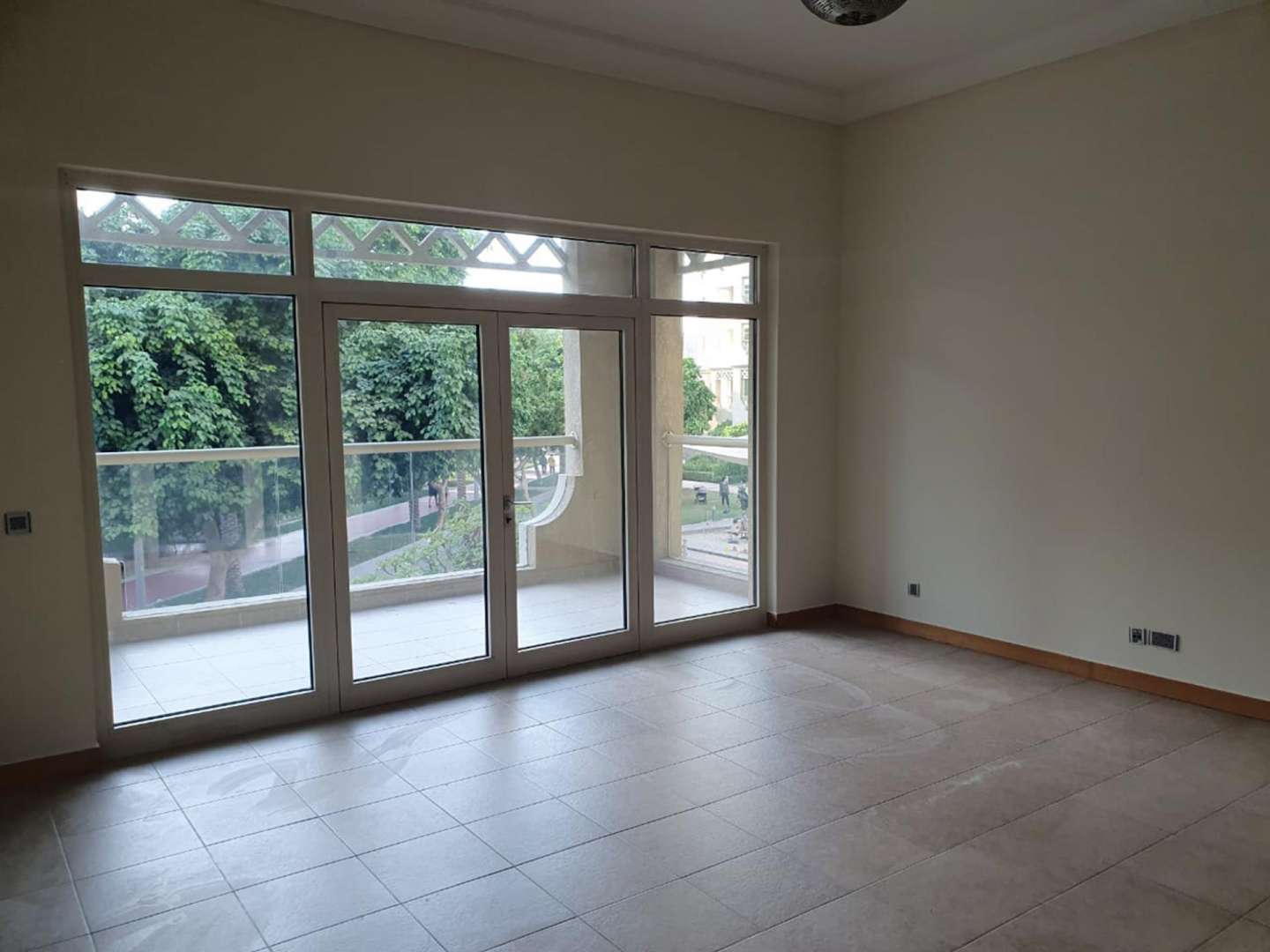 Spacious living room with large windows in Palm Jumeirah apartment for rent