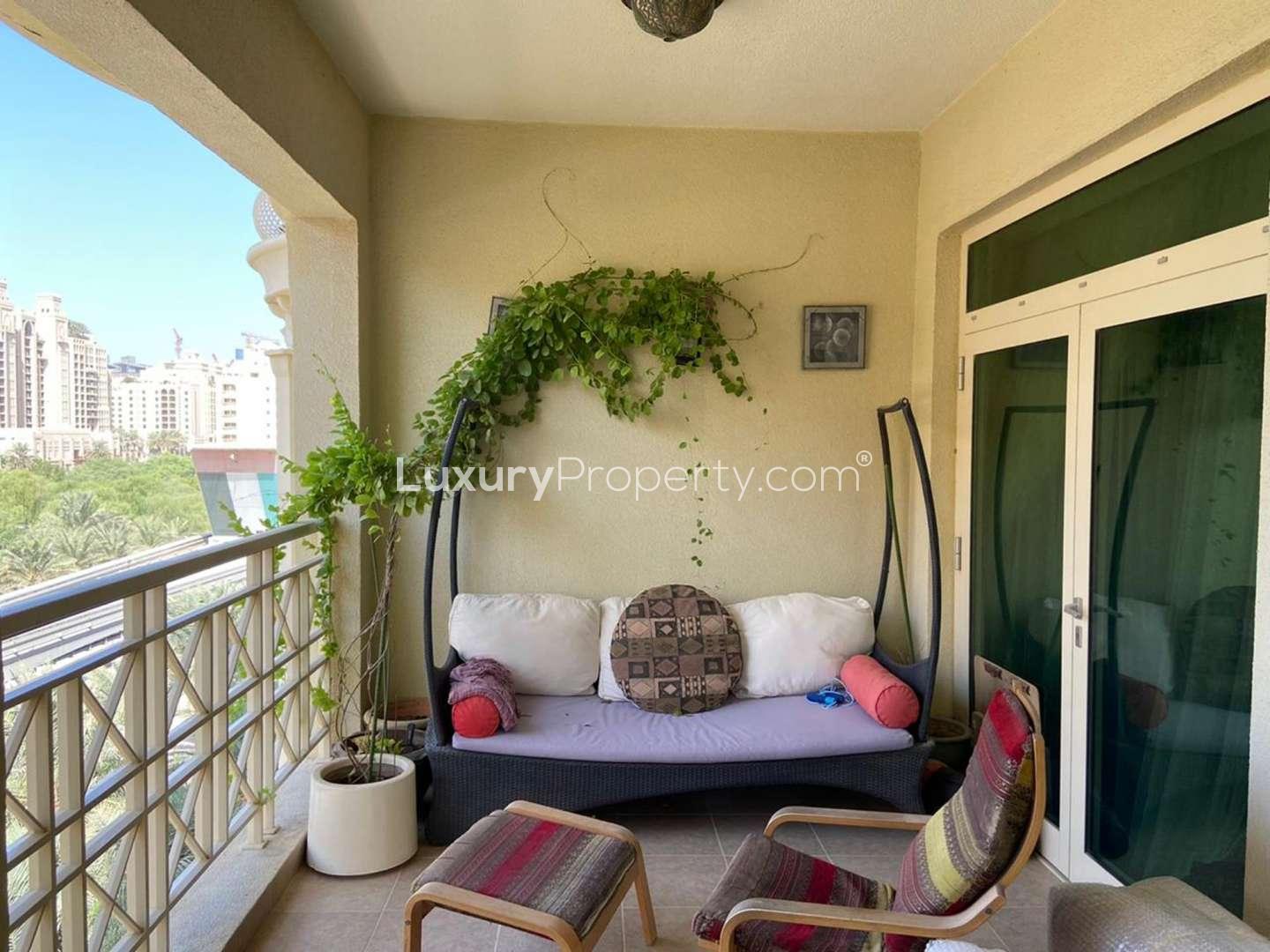 "Cozy living room in Shoreline Residences 2-bedroom apartment, Palm Jumeirah for rent.",Cozy balcony with seating in Shoreline Residences apartment, Palm Jumeirah, for rent
