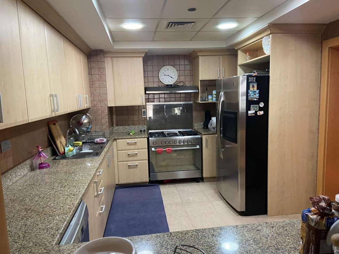 Modern kitchen in 2-bedroom Shoreline Residences apartment, Palm Jumeirah, with stainless steel appliances