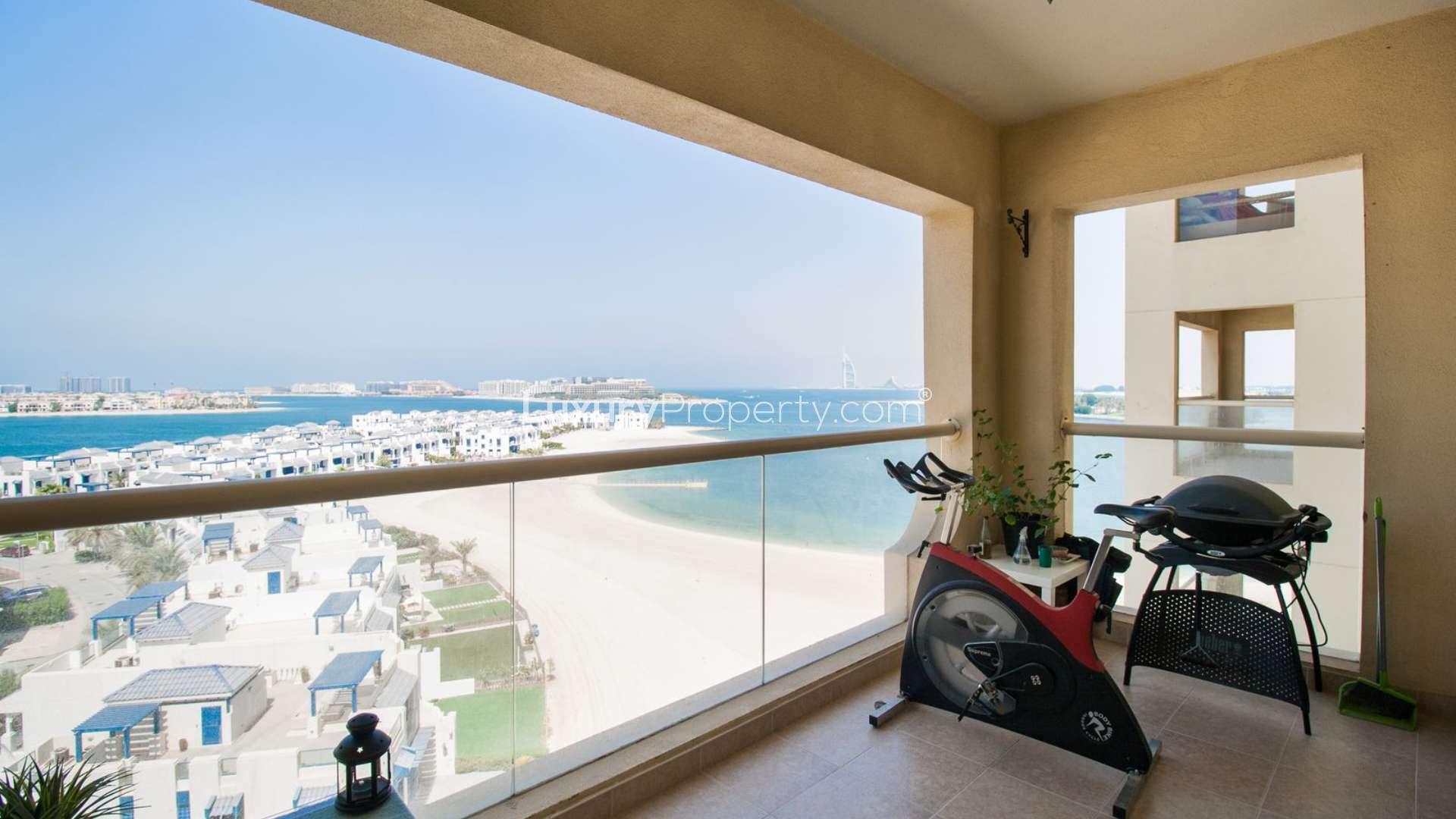 Fully furnished living room in Palm Jumeirah Shoreline Apartments with sea view balcony