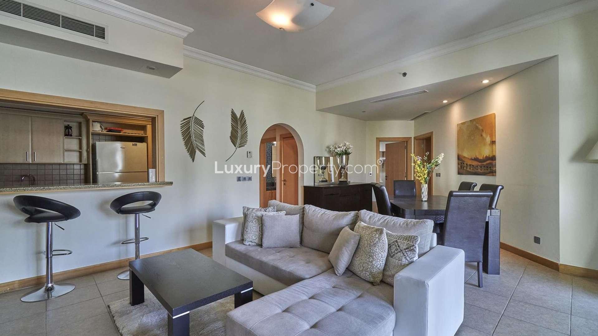Two-bedroom apartment interior in Shoreline, Palm Jumeirah with modern decor and large window view