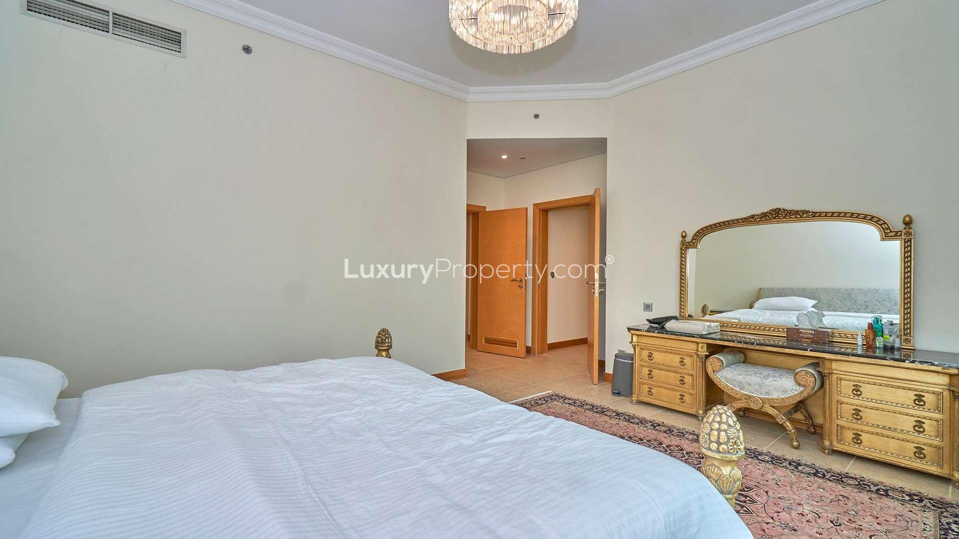 Furnished bedroom in Shoreline Apartments, Palm Jumeirah, featuring elegant decor and ample space