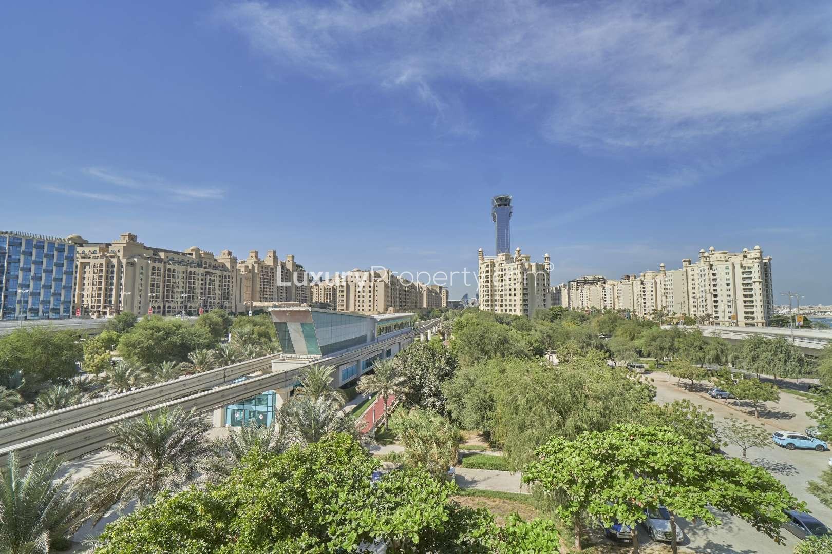 Modern kitchen in 2-bedroom apartment, Shoreline Apartments, Palm Jumeirah, granite countertops, wooden cabinets