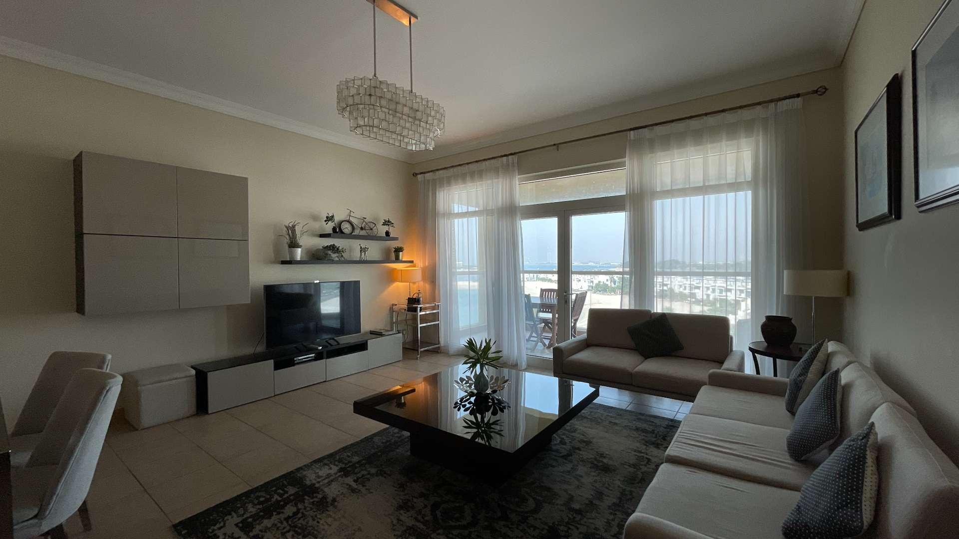 Fully furnished living room in modern two-bedroom sea-facing apartment, Shoreline Apartments, Palm Jumeirah