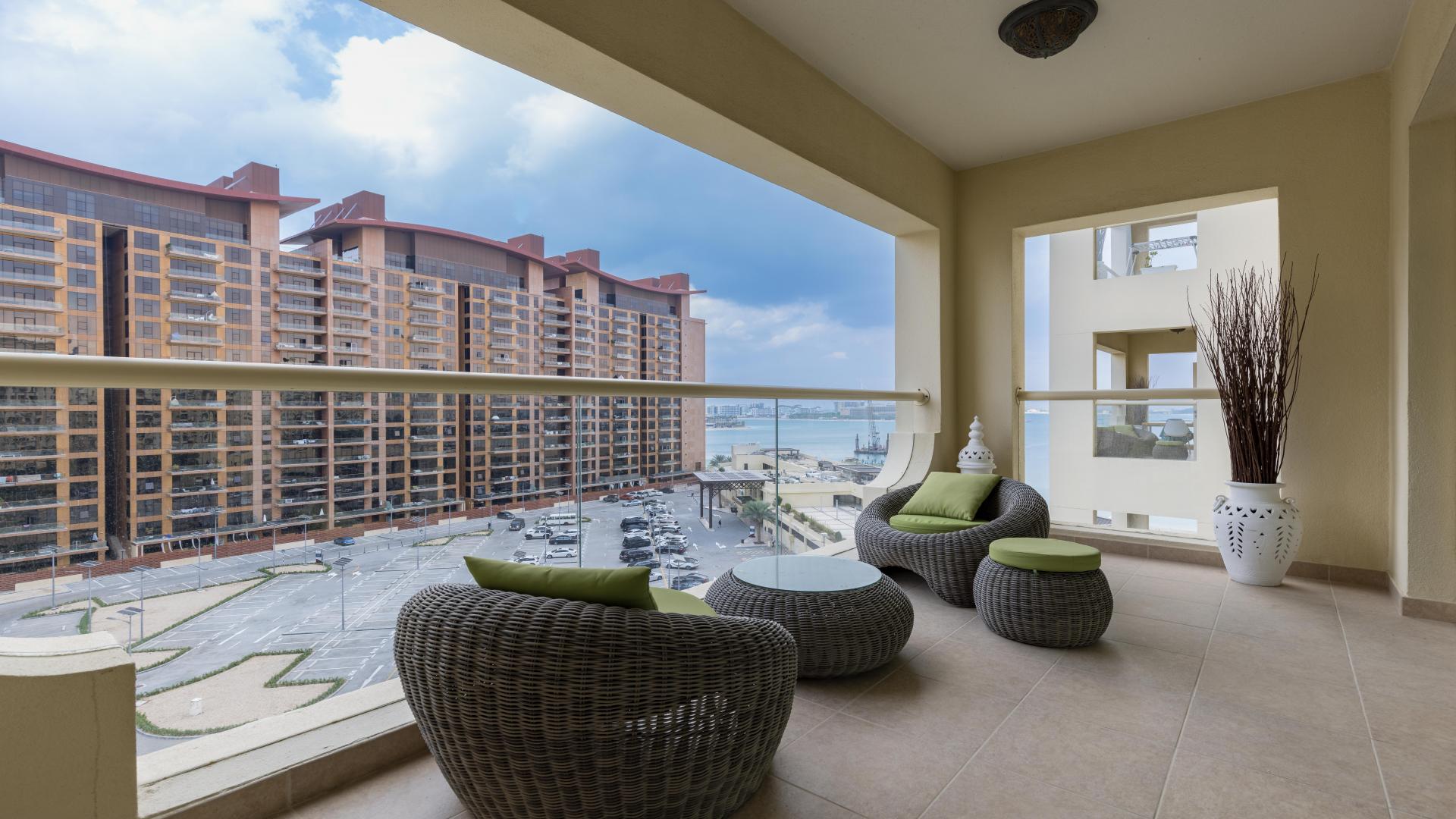 Furnished living room in Palm Jumeirah Shoreline Apartment with sea view balcony access