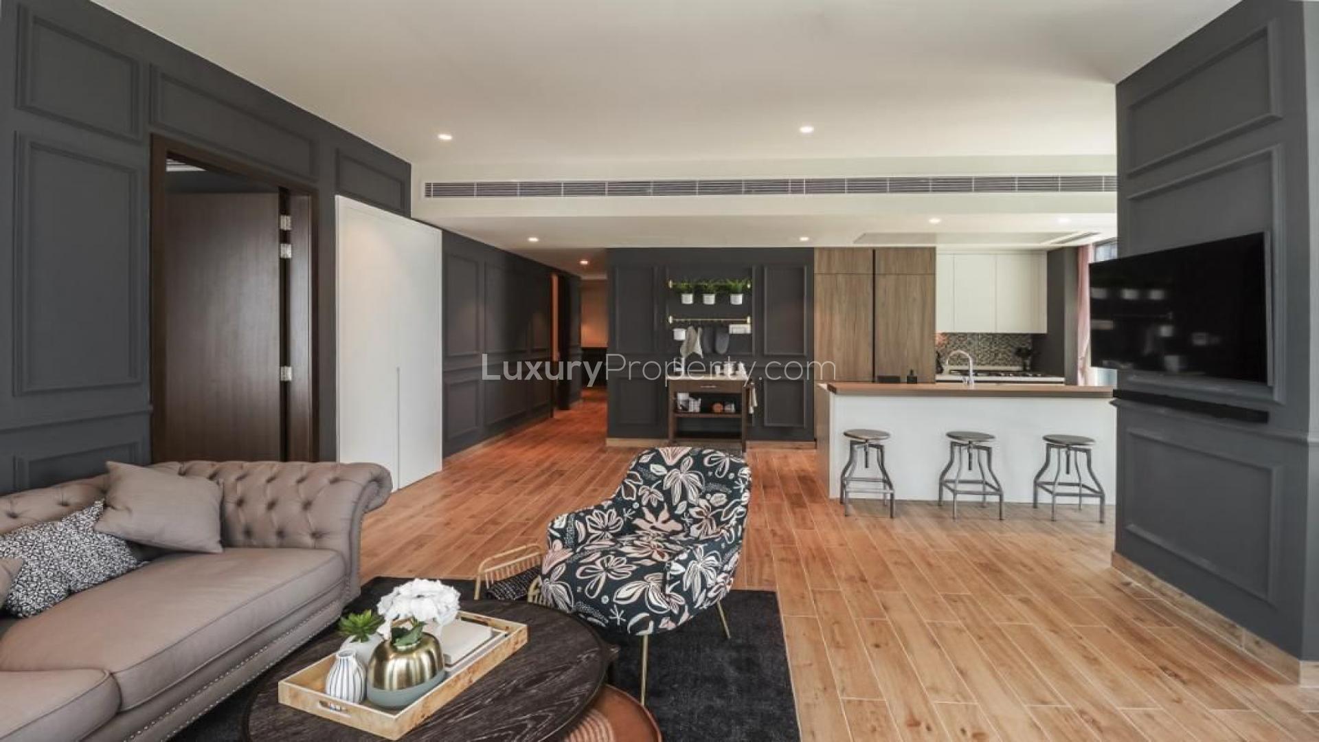 Balcony view of Dubai Marina from Marina Gate apartment with wicker chairs