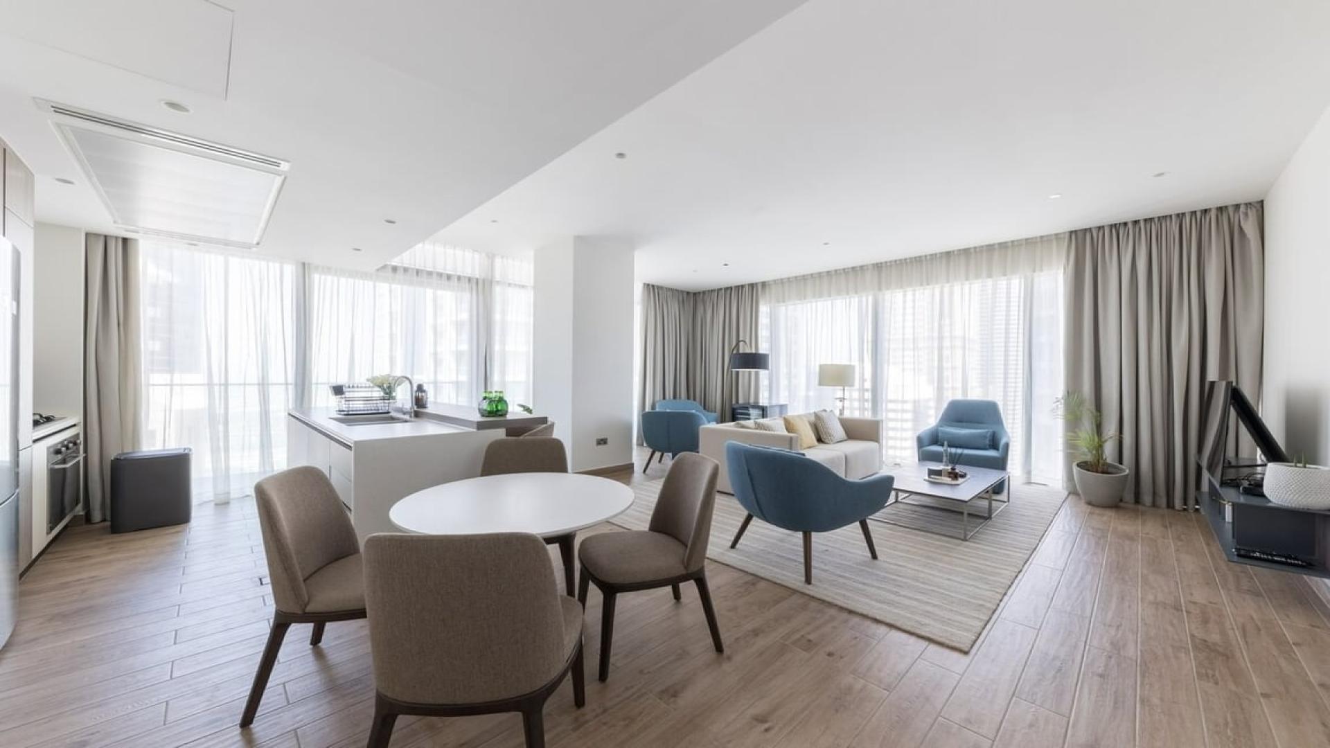 Furnished bedroom in high-floor Dubai Marina apartment with city and water views