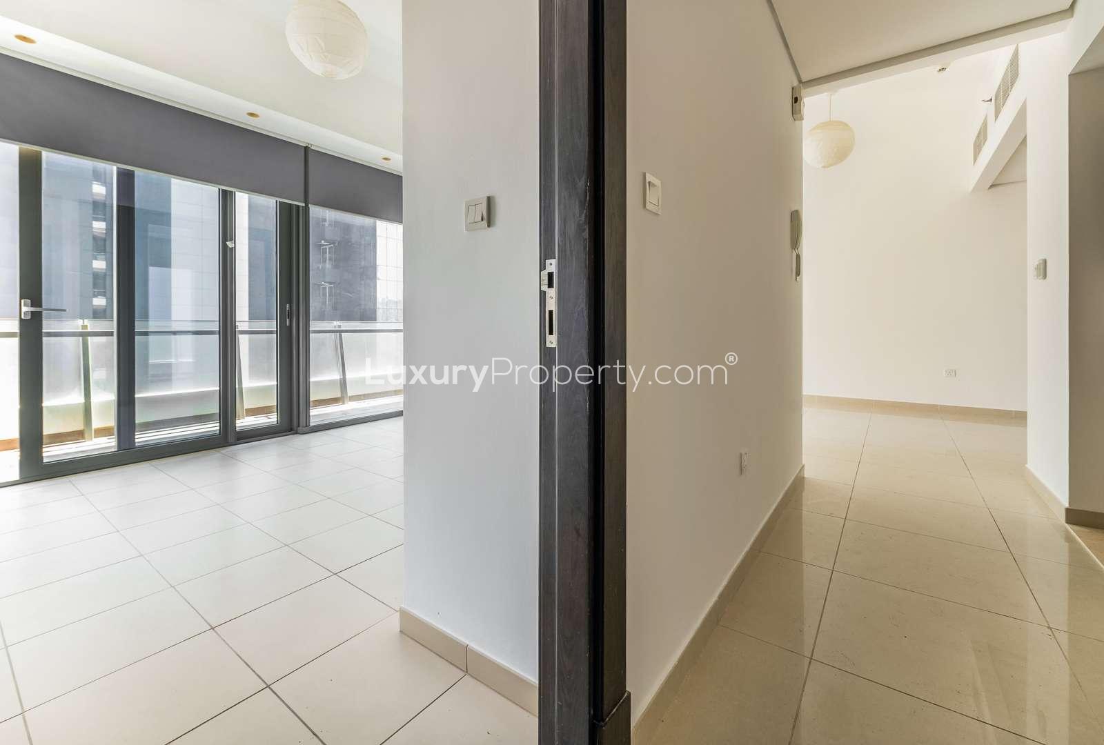 N/A,Modern living room with large windows in Dubai Marina apartment, Silverene community