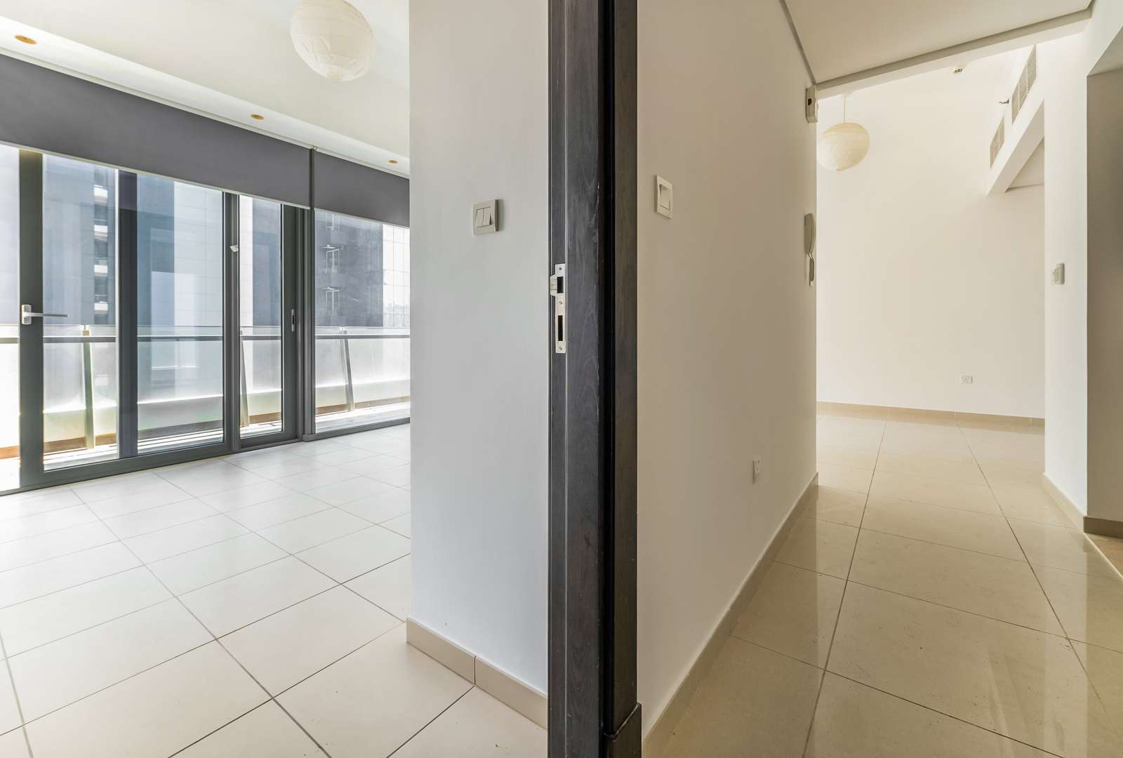 N/A,Modern living room with large windows in Dubai Marina apartment, Silverene community