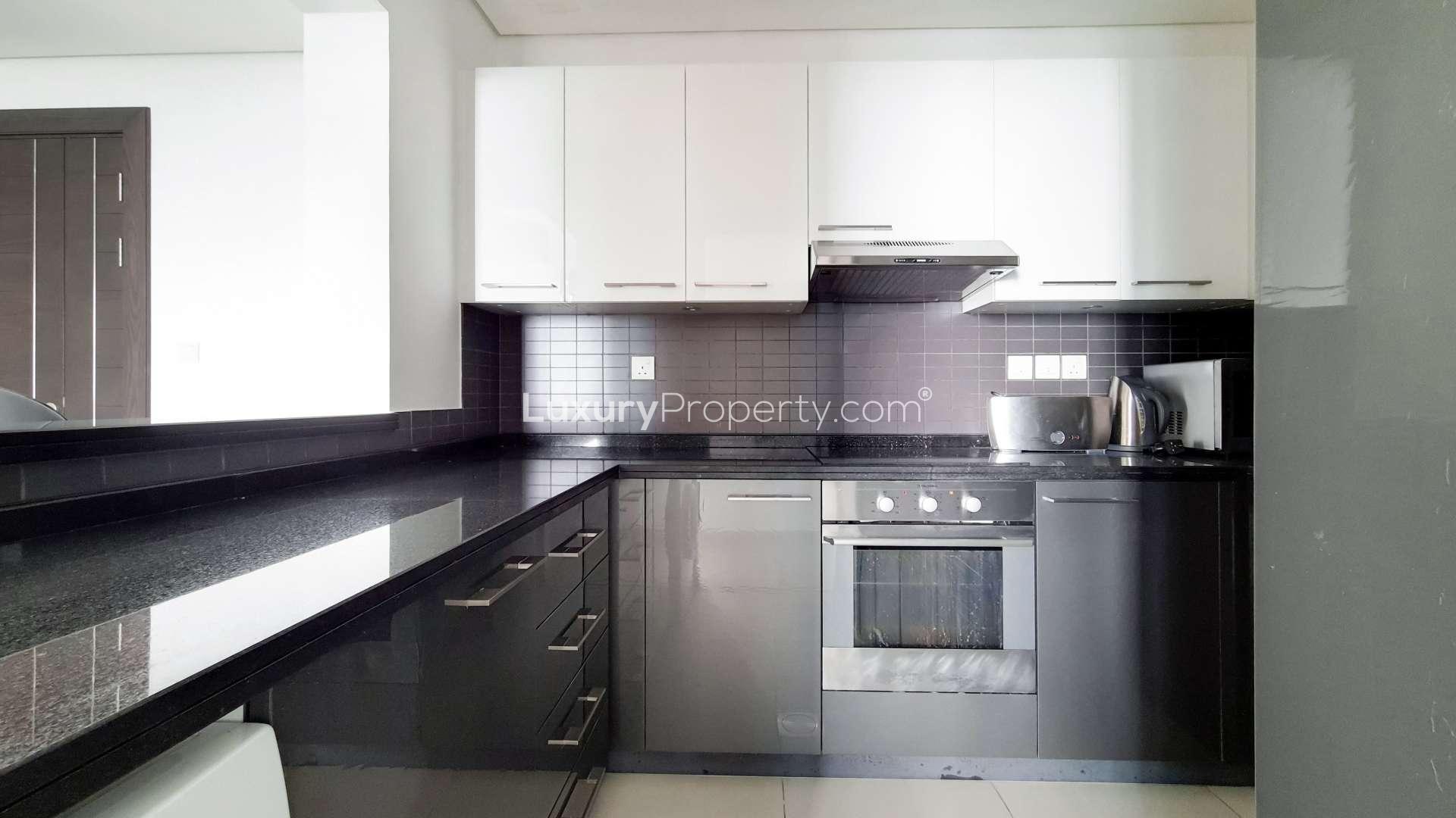 Furnished living room in high-floor Dubai Marina apartment, Silverene, with modern decor and balcony