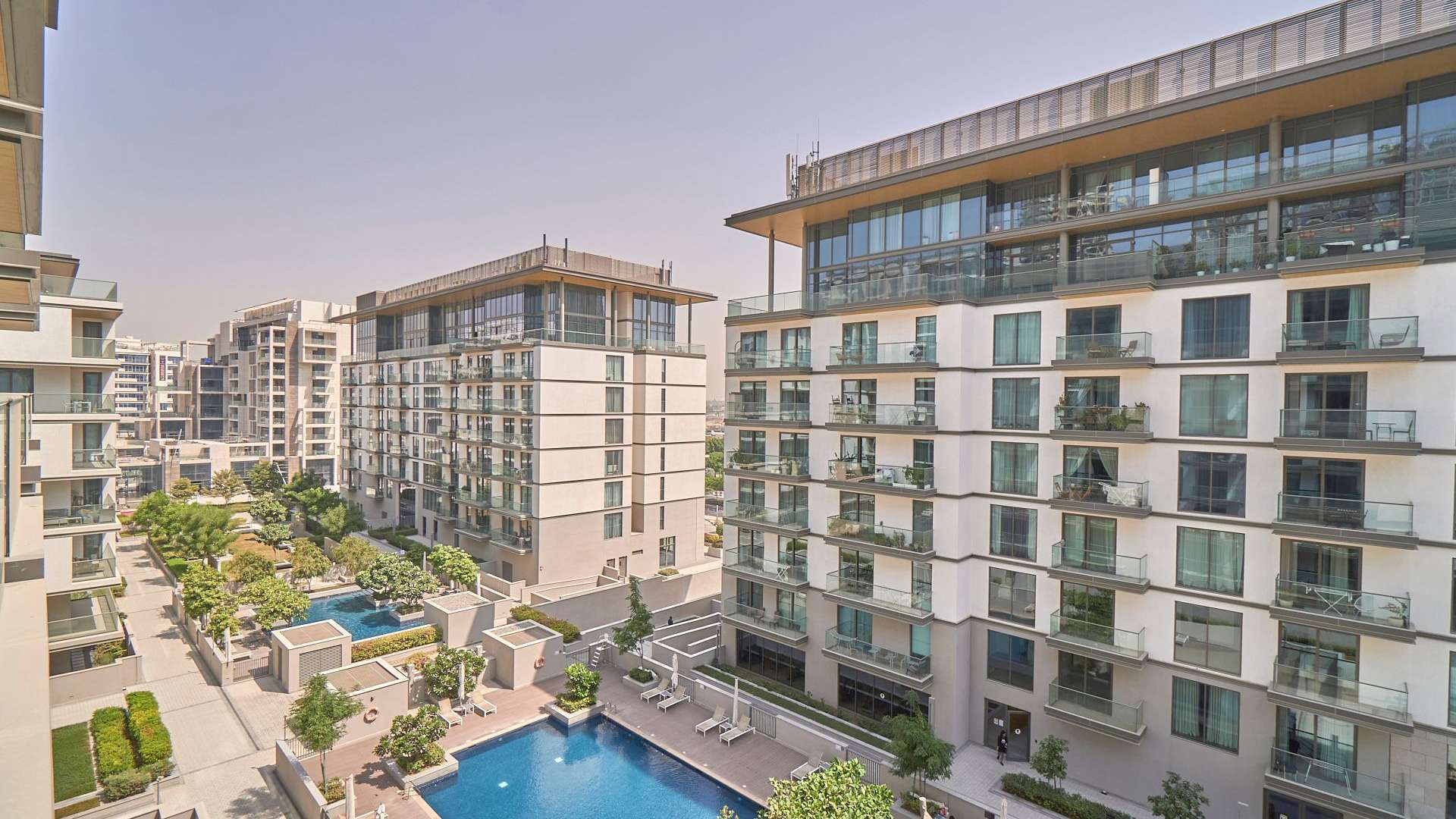 Modern apartment buildings with pool in Sobha Hartland, MBR City, available for rent