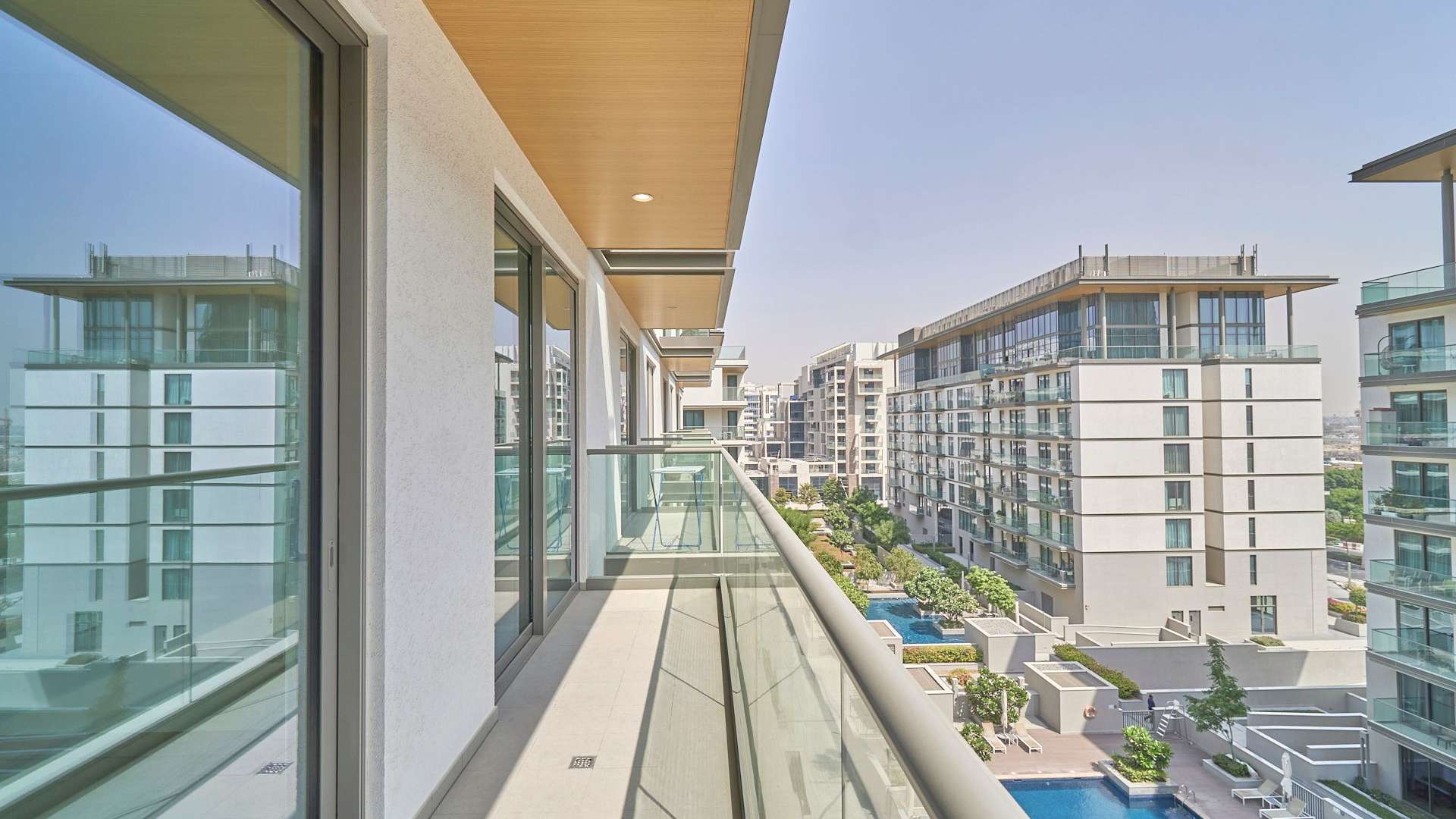 Balcony view of modern apartment in Sobha Hartland, MBR City, showcasing urban landscape