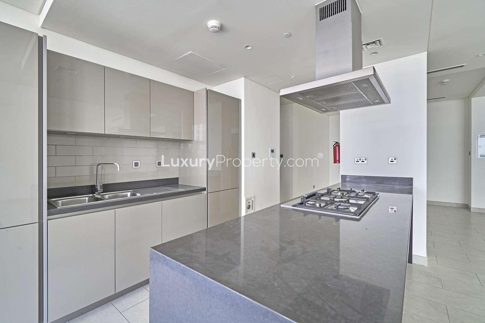 Modern kitchen in 2-bedroom apartment, Sobha Hartland Greens, Dubai, with city view